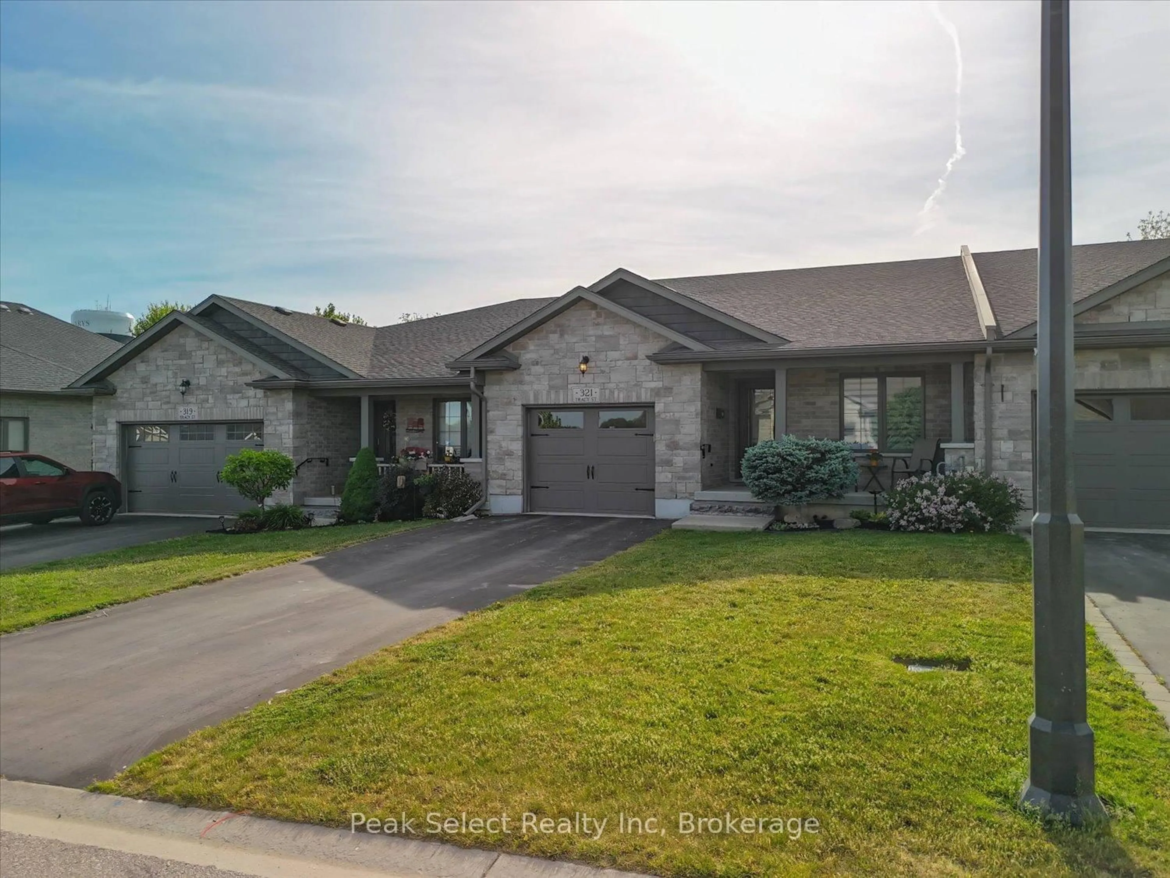 Home with brick exterior material, street for 321 Tracy St, St. Marys Ontario N4X 0B4