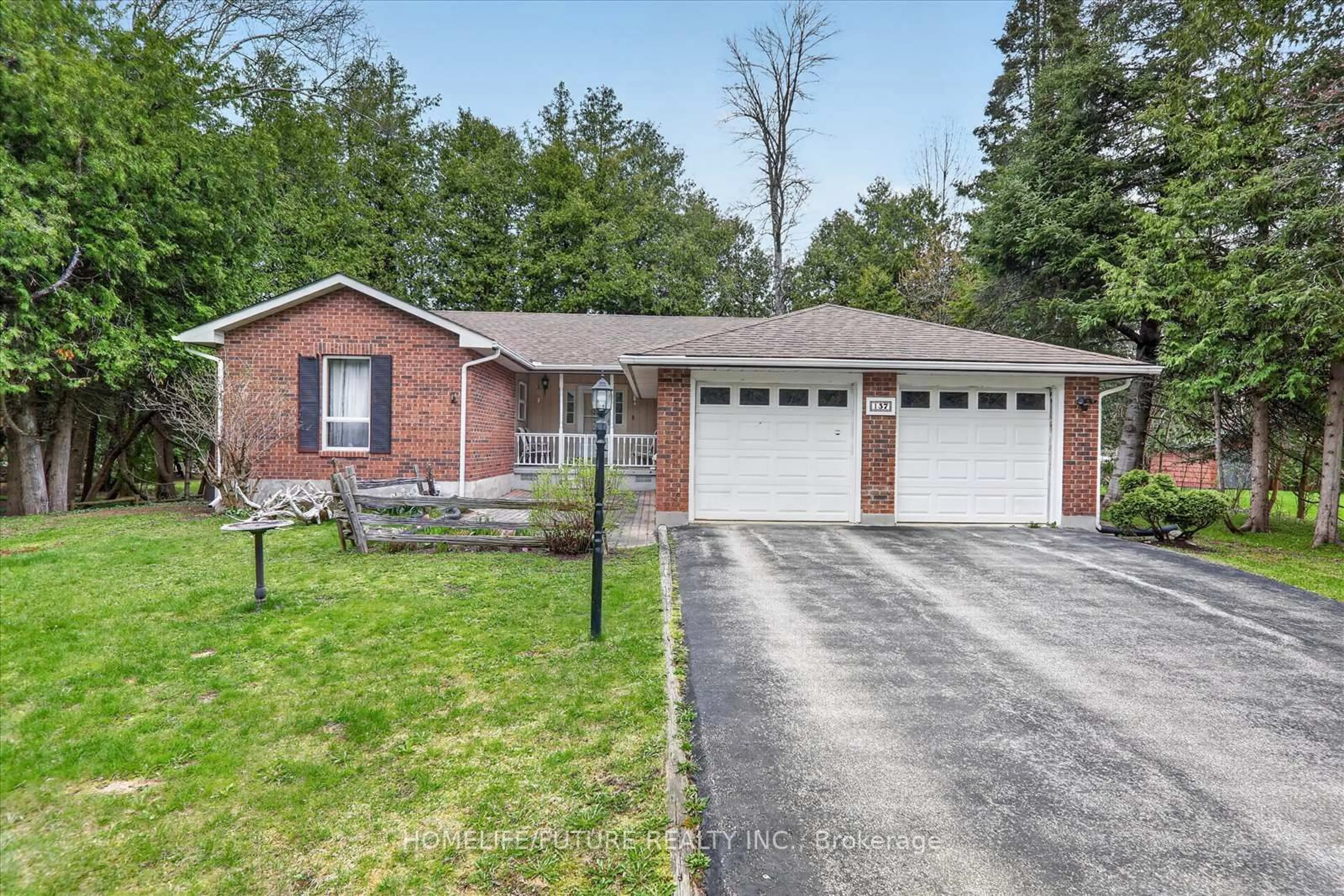 Home with brick exterior material, street for 137 Woodland Park Rd, Blue Mountains Ontario N0H 1J0