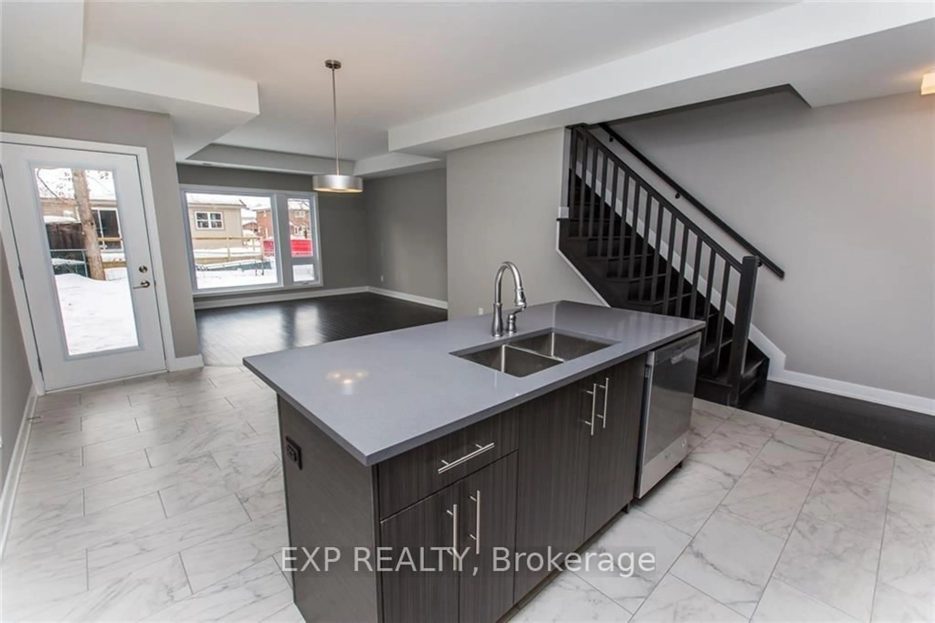 Open concept kitchen, cement floor for 546 Guy St, Ottawa Ontario K1K 1B9