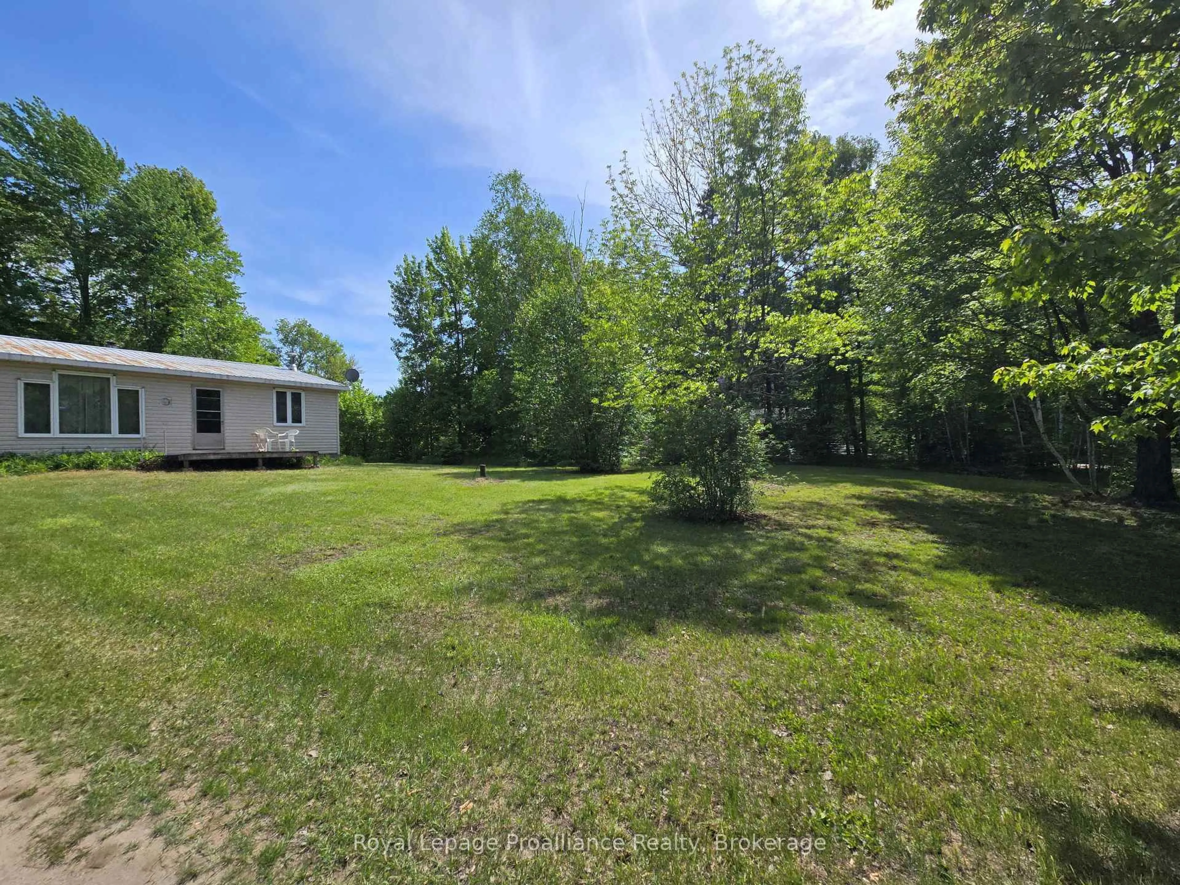 A pic from outside/outdoor area/front of a property/back of a property/a pic from drone, forest/trees view for 1699 Bordenwood Rd, Arden Ontario K0H 1B0
