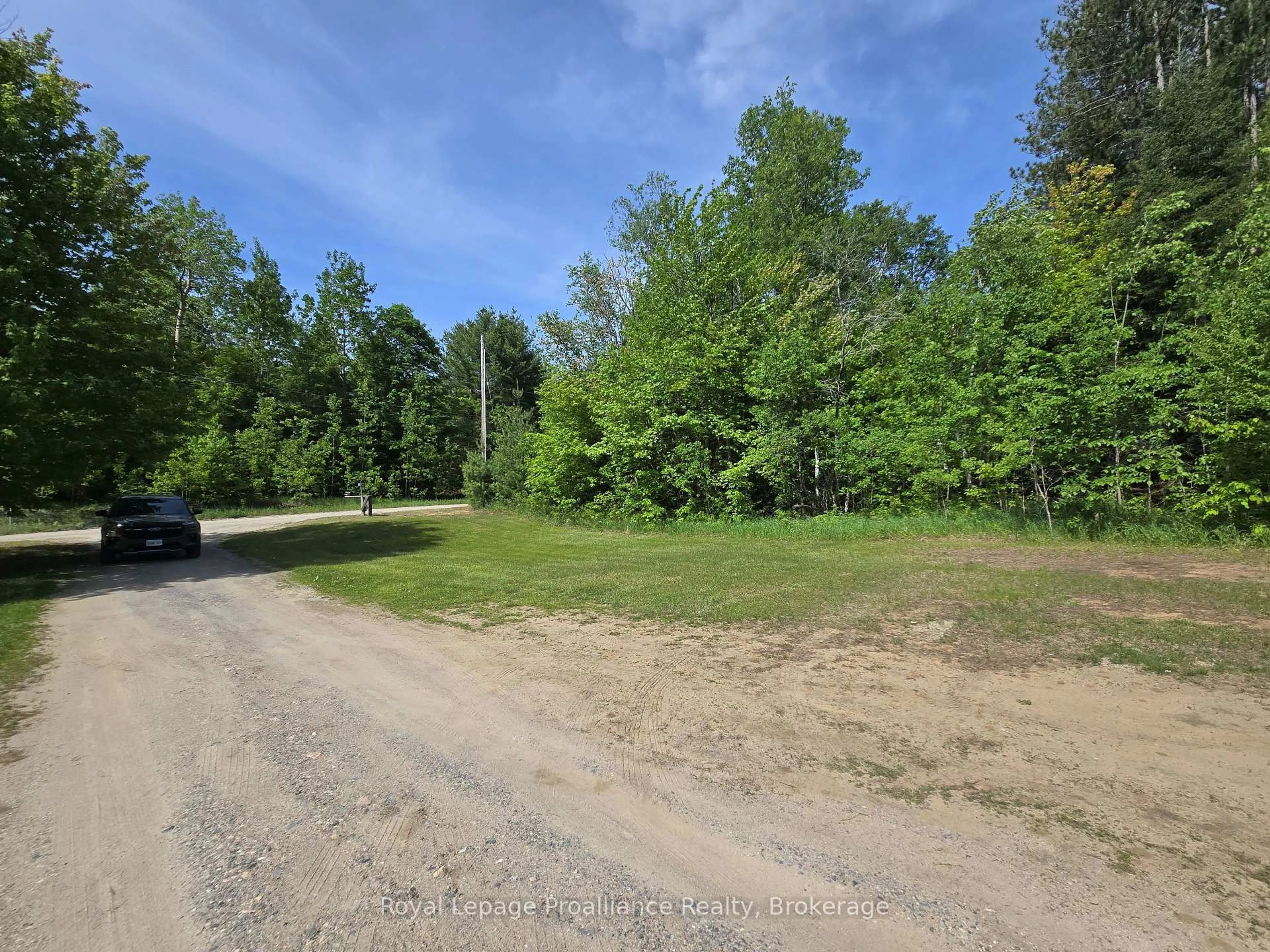 A pic from outside/outdoor area/front of a property/back of a property/a pic from drone, forest/trees view for 1699 Bordenwood Rd, Arden Ontario K0H 1B0