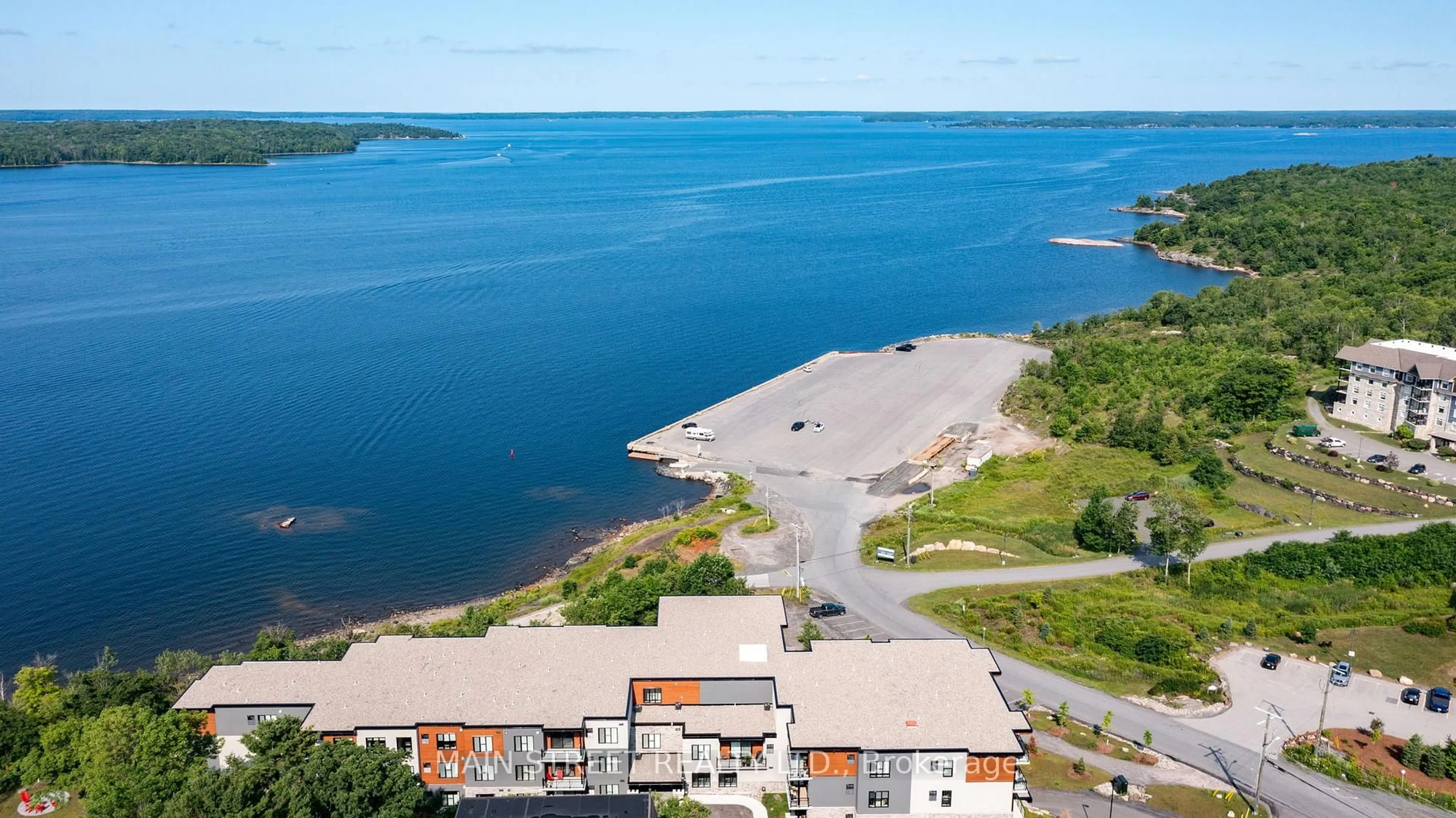 A pic from outside/outdoor area/front of a property/back of a property/a pic from drone, water/lake/river/ocean view for 20 Salt Dock Rd #203, Parry Sound Ontario P2A 0E7