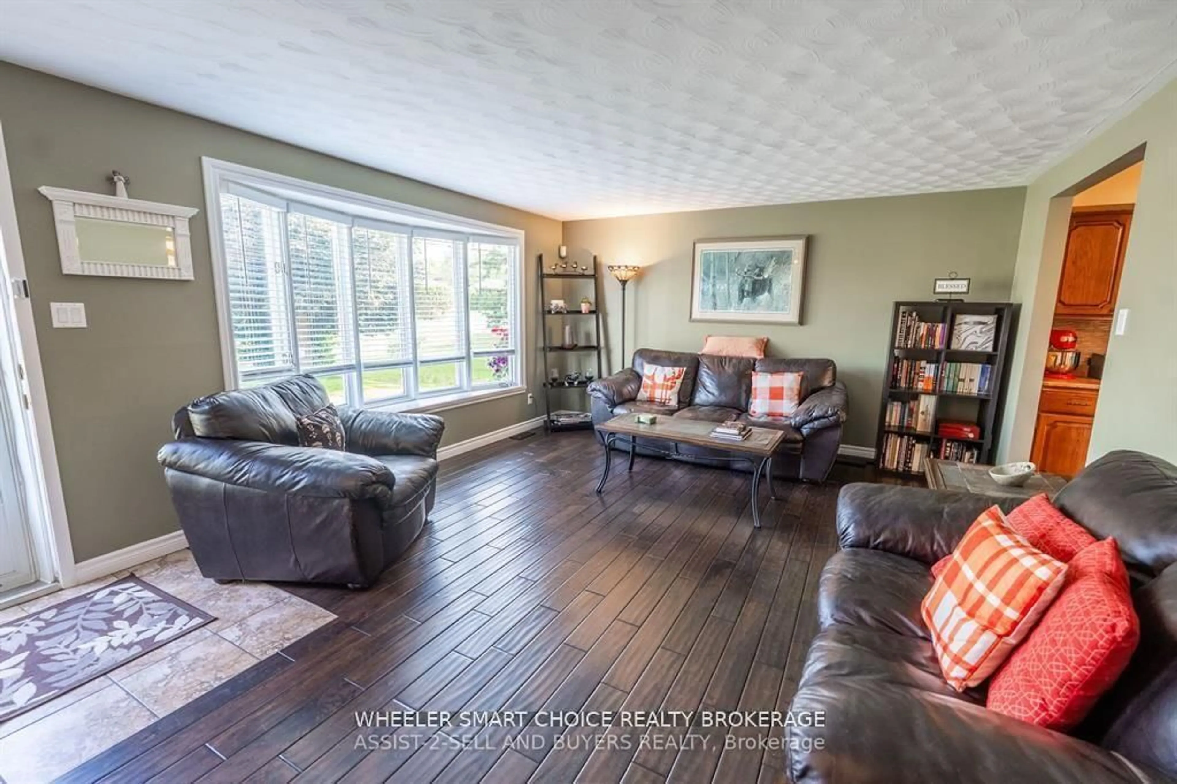 Living room with furniture, wood/laminate floor for 17407 County Rd 18 Rd, South Stormont Ontario K0C 2A0