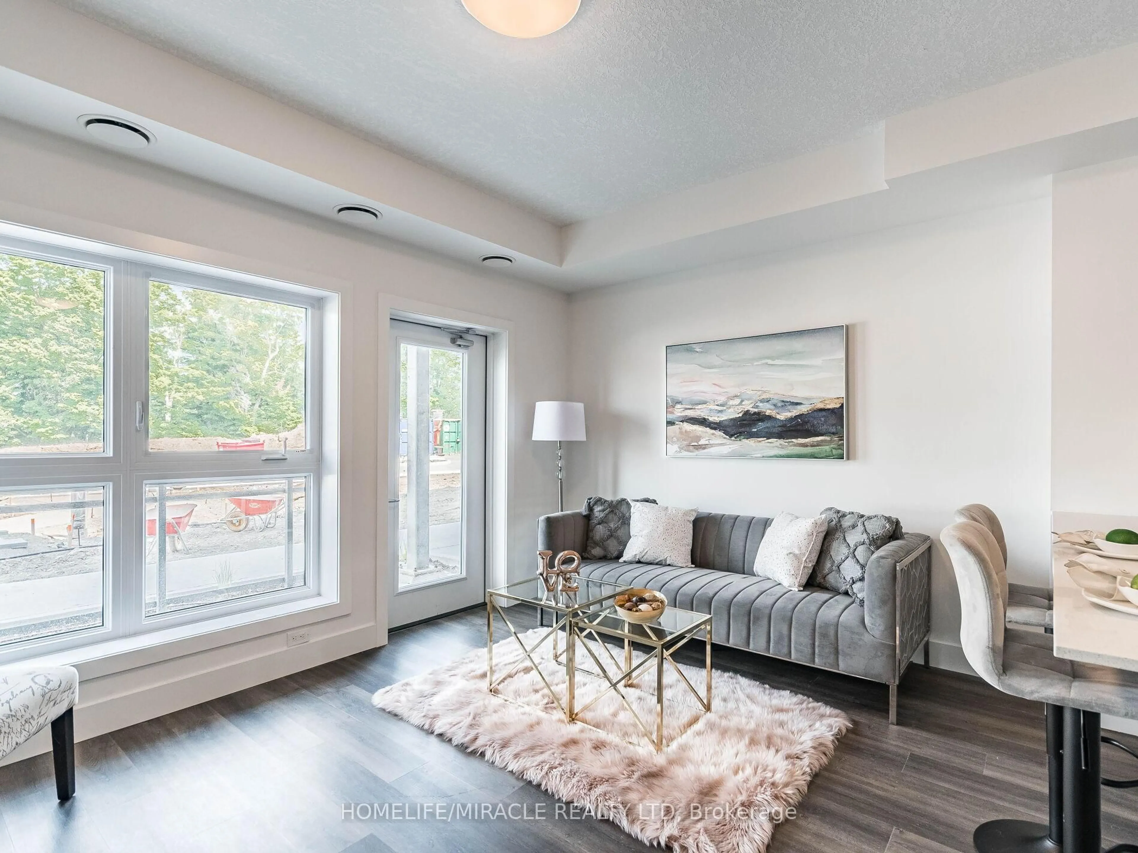 Living room with furniture, wood/laminate floor for 1101 Lackner Pl #T2, Kitchener Ontario N2A 0L3