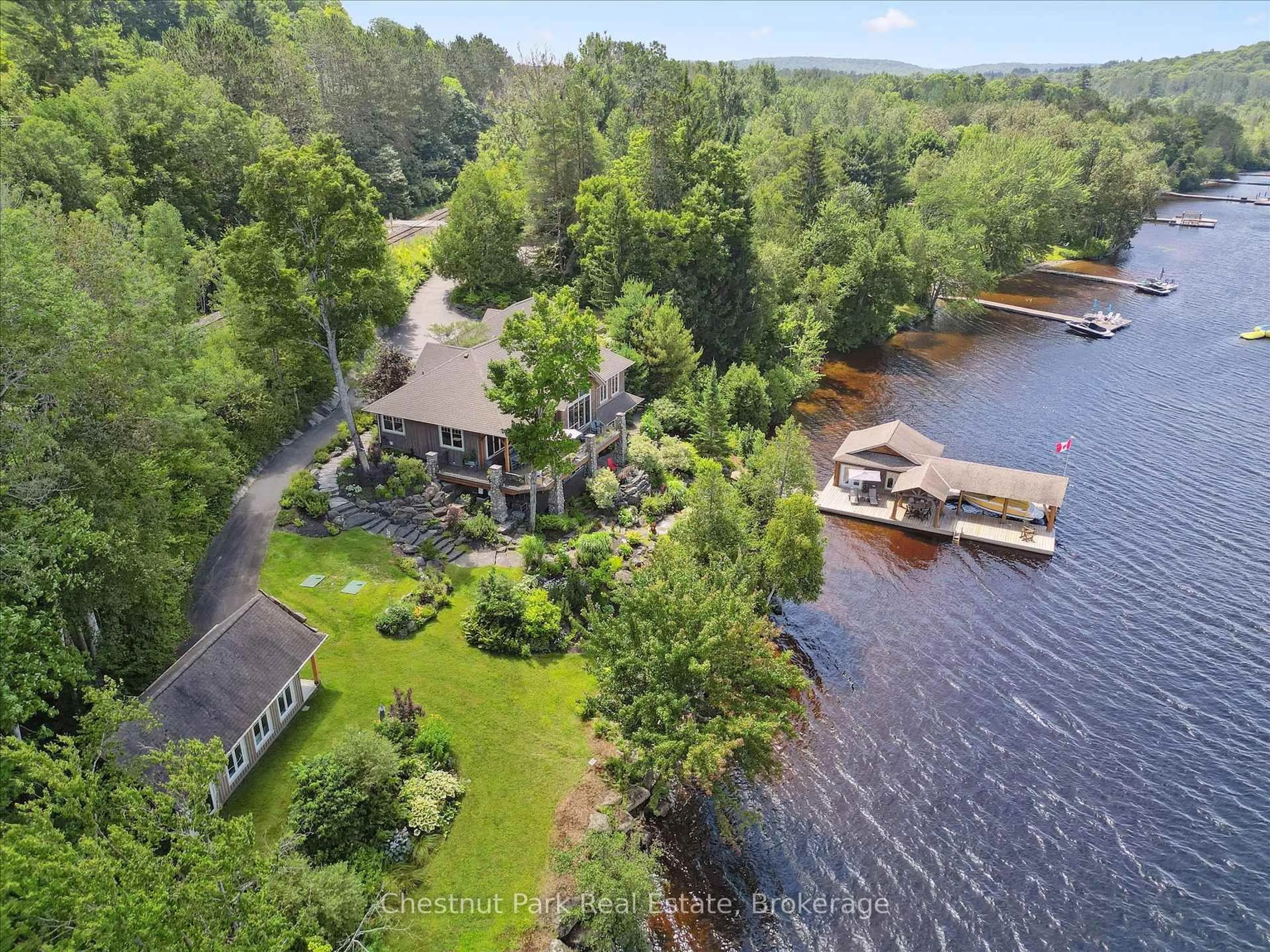 A pic from outside/outdoor area/front of a property/back of a property/a pic from drone, water/lake/river/ocean view for 904 Aspdin Rd, Huntsville Ontario P1H 2J2