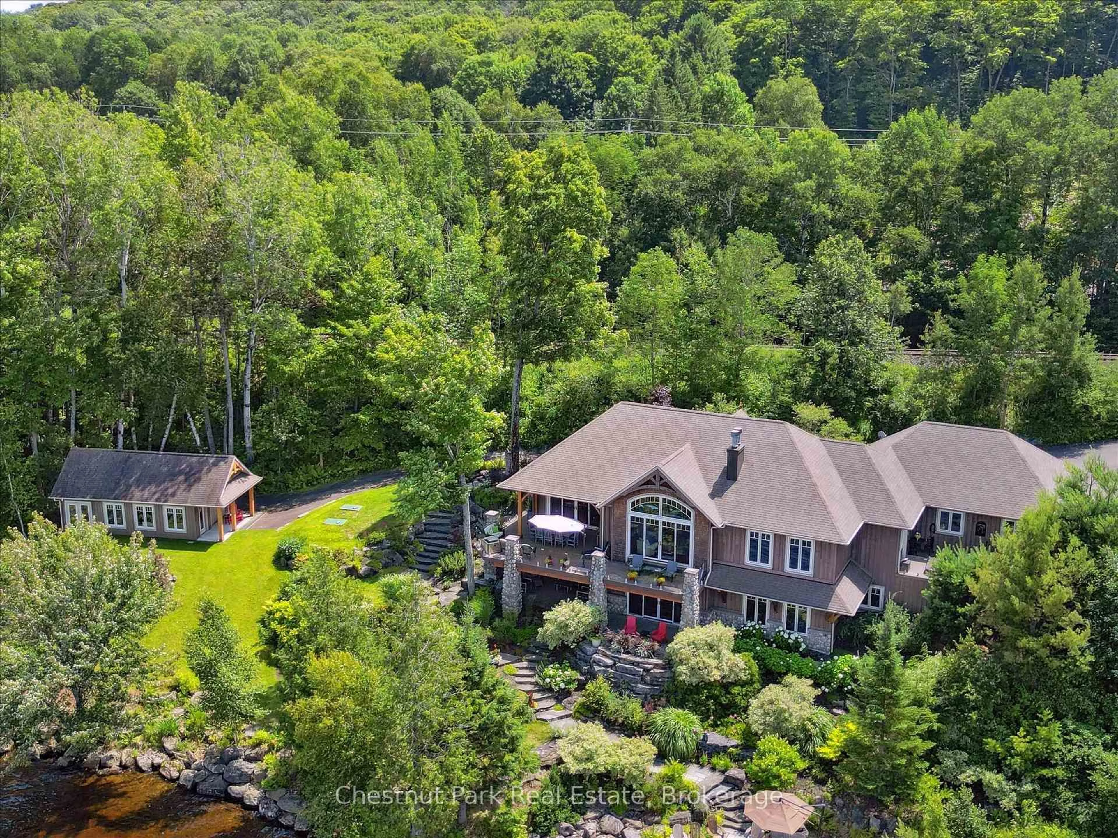 A pic from outside/outdoor area/front of a property/back of a property/a pic from drone, water/lake/river/ocean view for 904 Aspdin Rd, Huntsville Ontario P1H 2J2