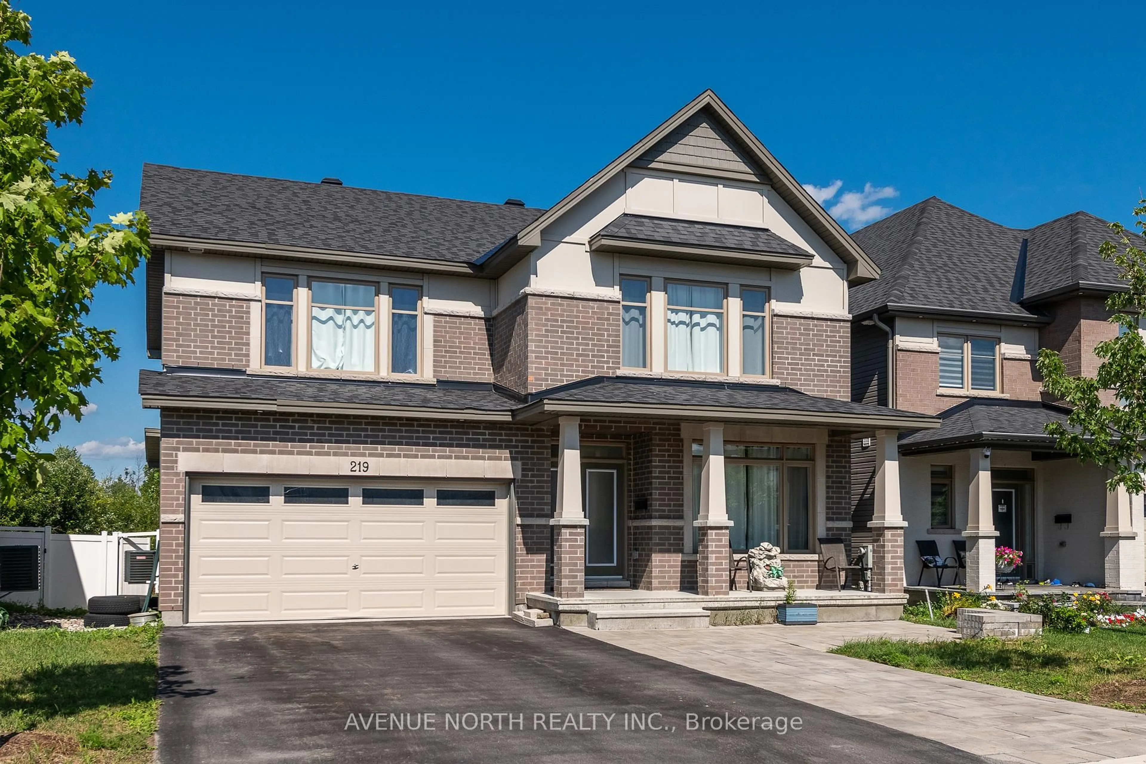 Home with brick exterior material, street for 219 Reisling Way, Ottawa Ontario K1T 0X1