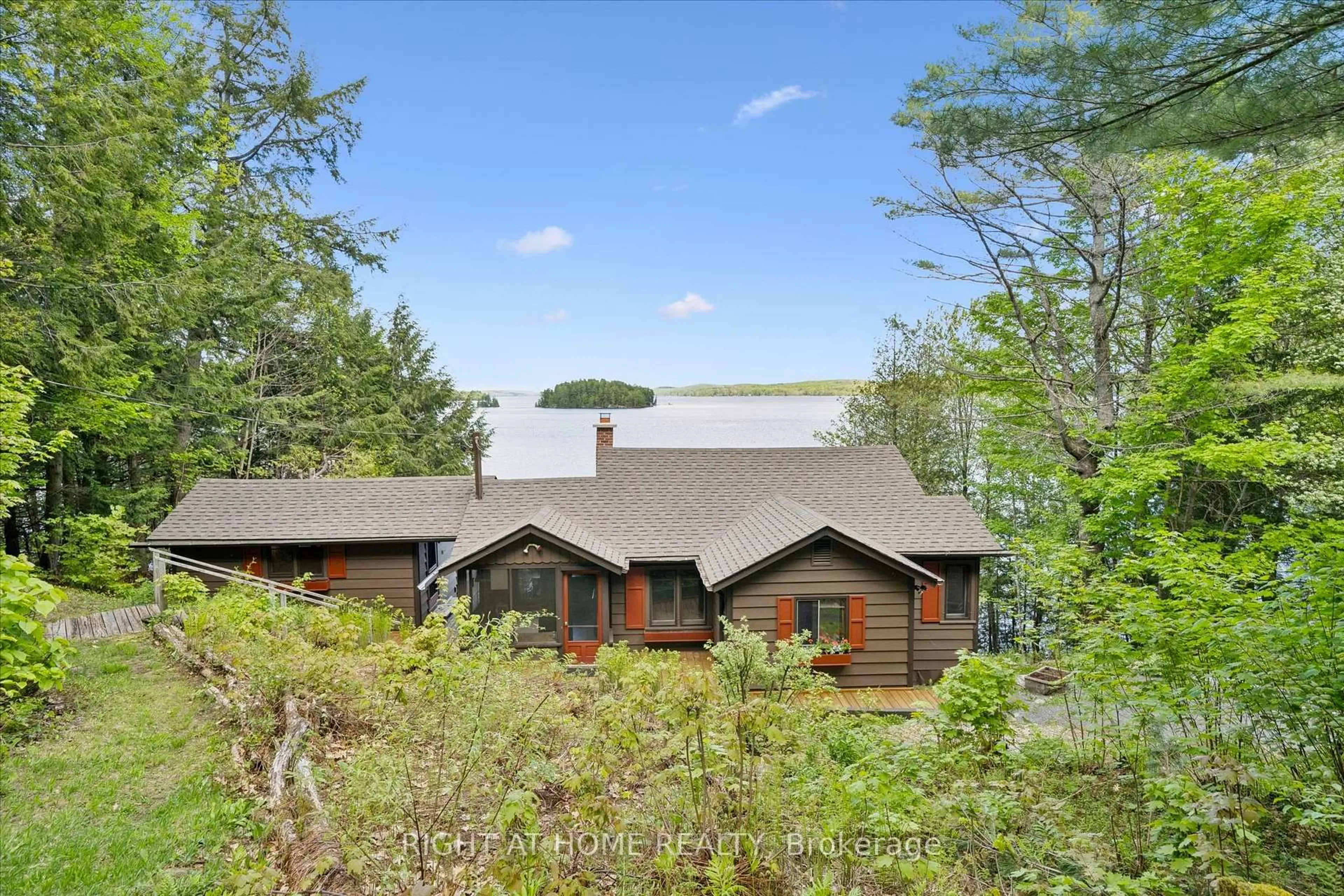 A pic from outside/outdoor area/front of a property/back of a property/a pic from drone, forest/trees view for 1159 Schufelt Rd, Lake of Bays Ontario P0B 1A0