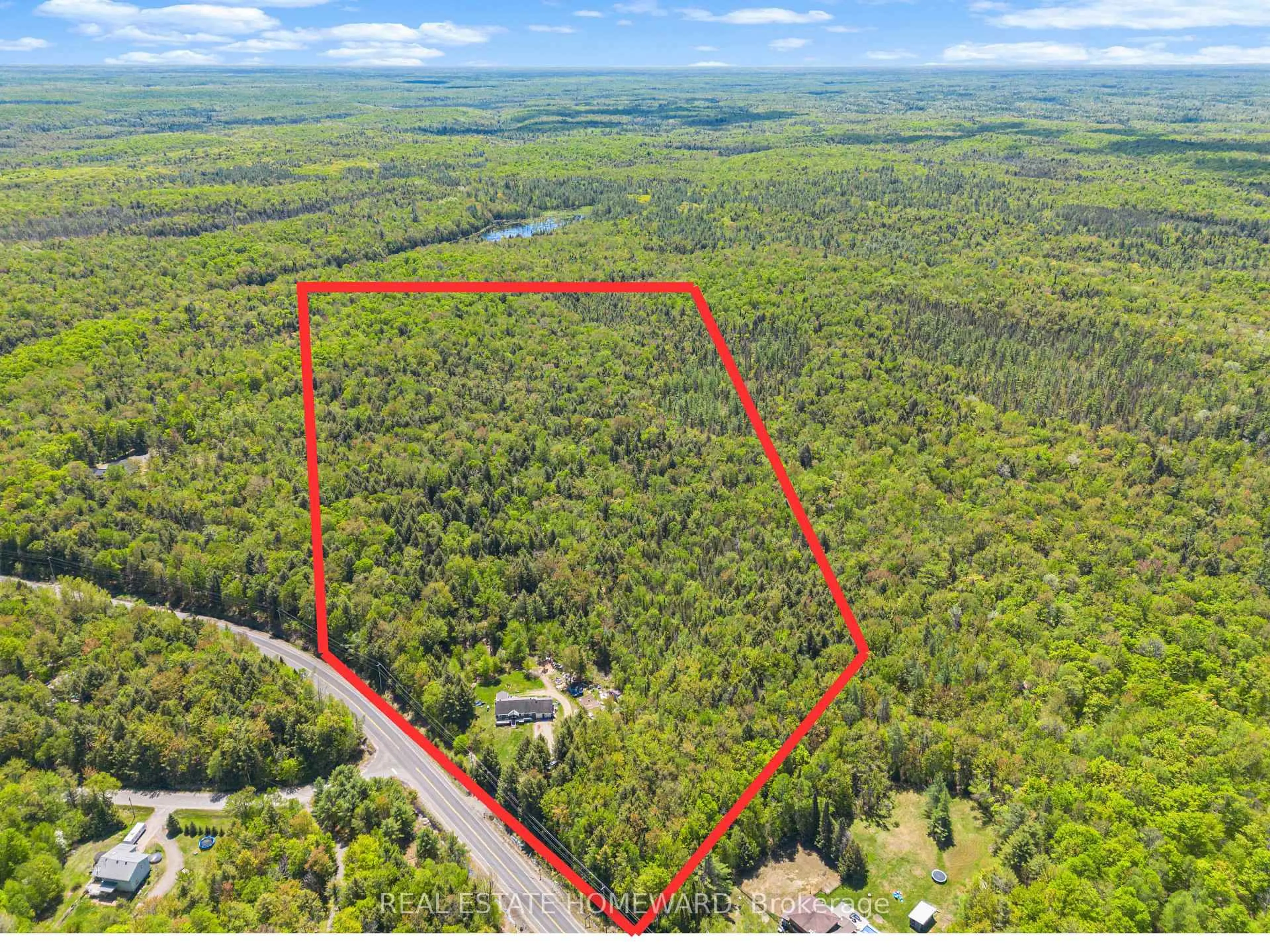 A pic from outside/outdoor area/front of a property/back of a property/a pic from drone, forest/trees view for 2928 118 Highway, Bracebridge Ontario P1P 1R3