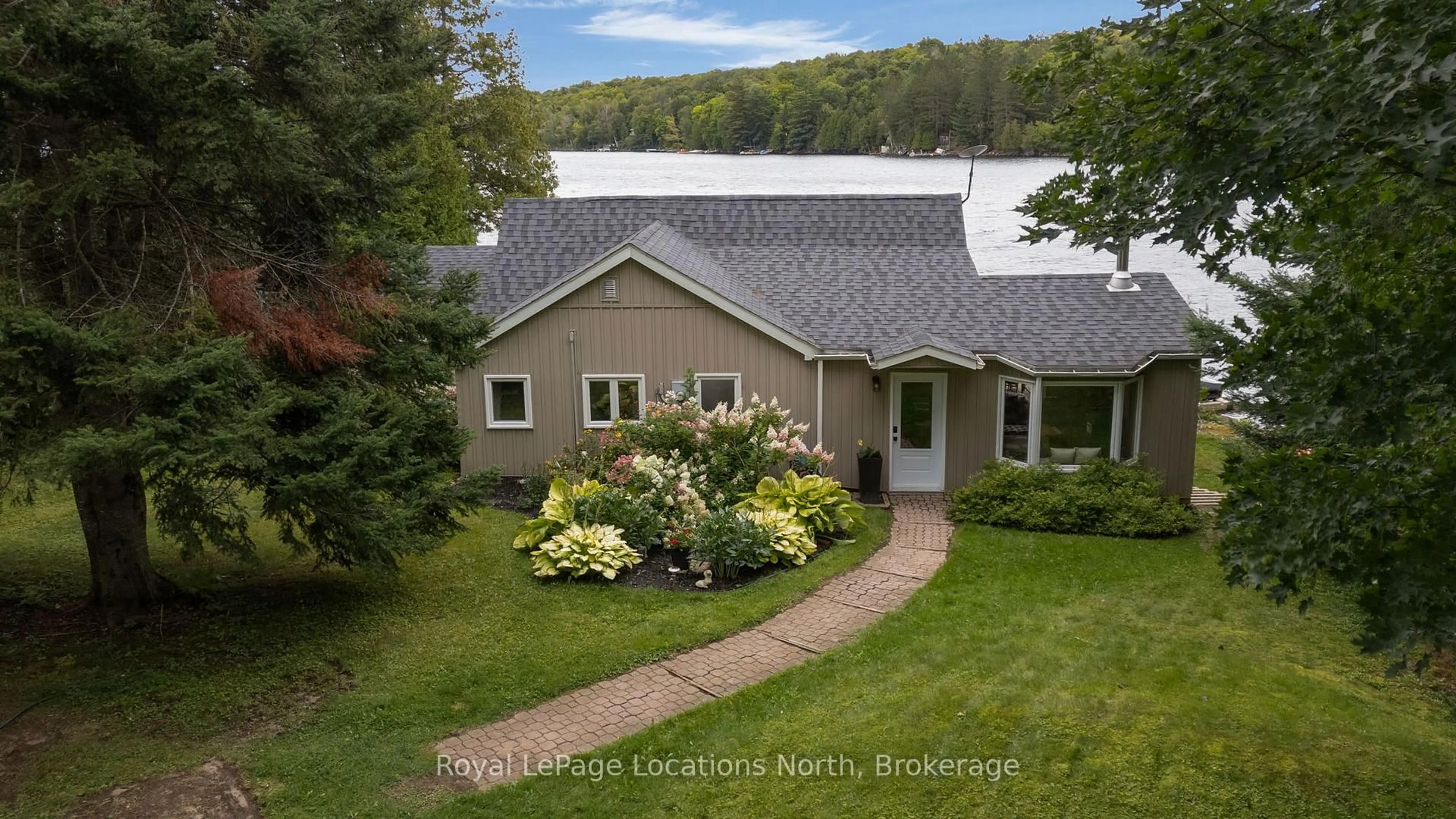 A pic from outside/outdoor area/front of a property/back of a property/a pic from drone, water/lake/river/ocean view for 1433 South Horn Lk Rd, Ryerson Ontario P0A 1C0