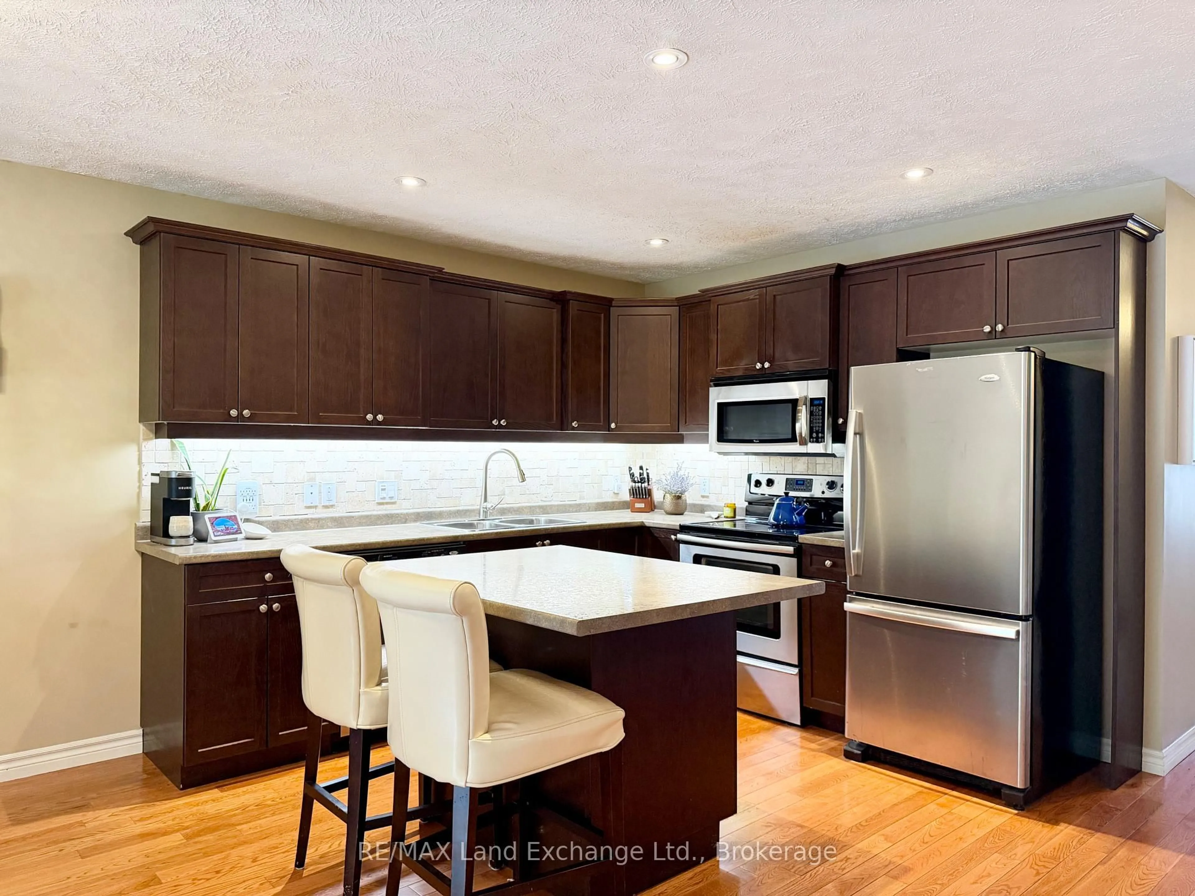 Open concept kitchen, wood/laminate floor for 219 Stickel St, Saugeen Shores Ontario N0H 2C1