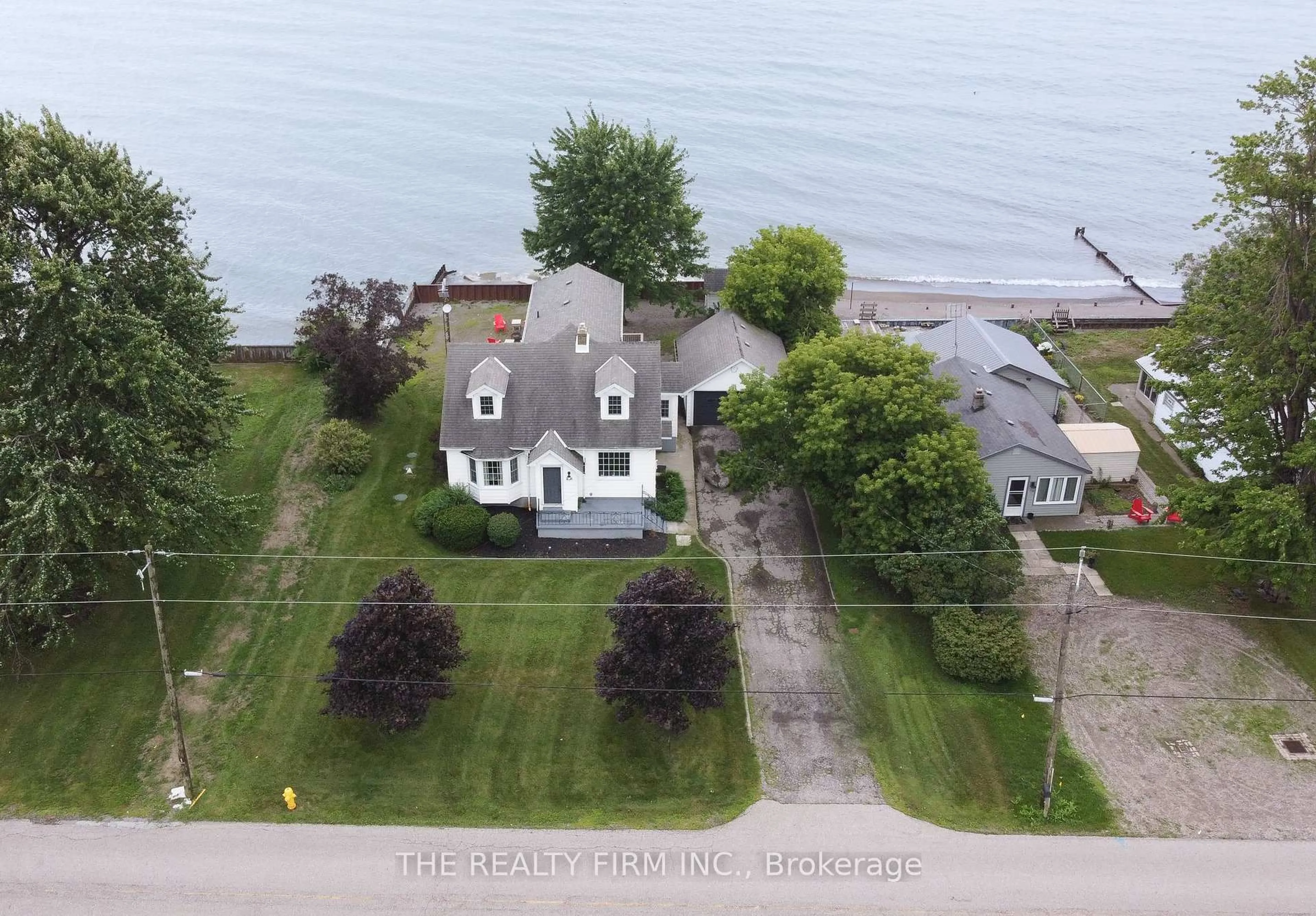 A pic from outside/outdoor area/front of a property/back of a property/a pic from drone, water/lake/river/ocean view for 18378 Erie Shore Dr, Chatham-Kent Ontario N0P 1A0