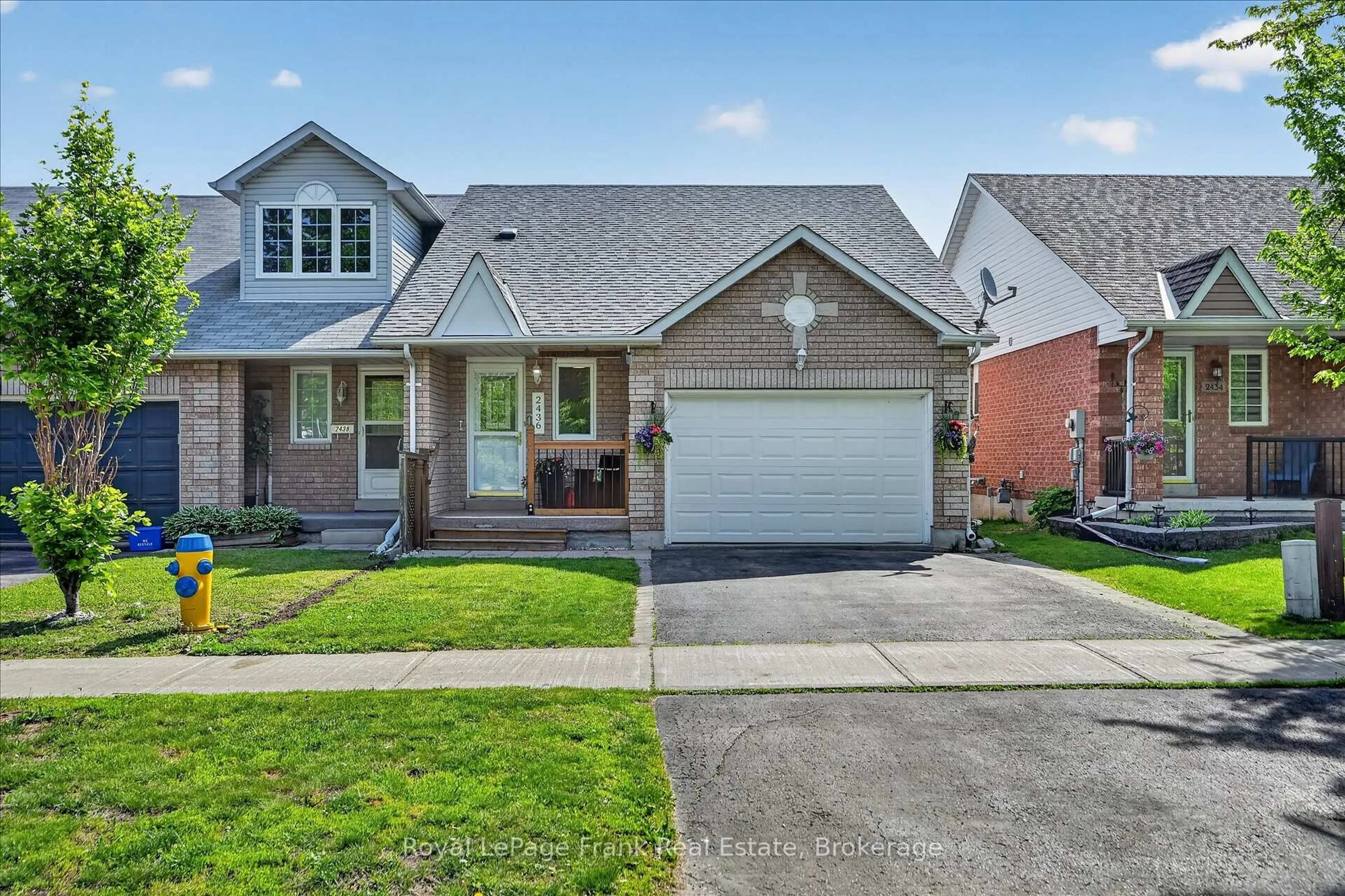 Home with brick exterior material, street for 2436 Woodglade Blvd, Peterborough Ontario K9K 2K9