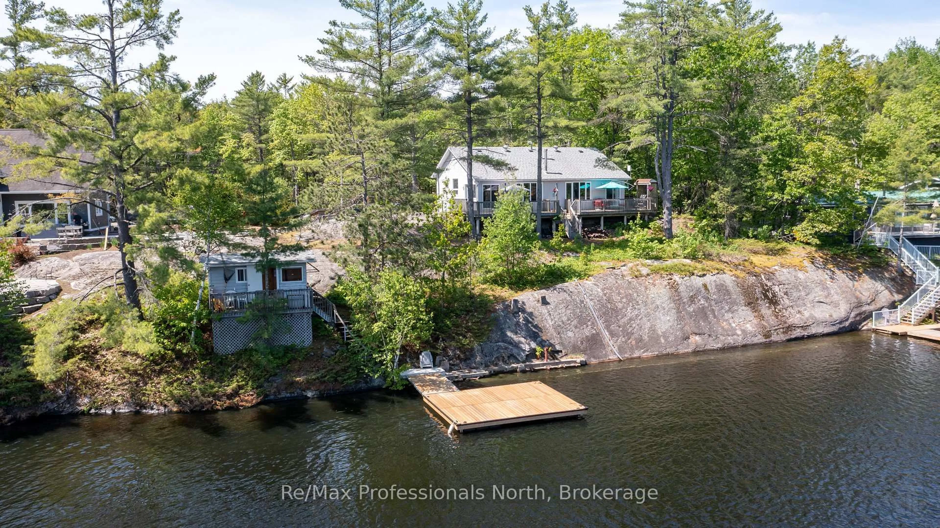 A pic from outside/outdoor area/front of a property/back of a property/a pic from drone, water/lake/river/ocean view for 5 Pinetree Rd, Gravenhurst Ontario P1P 0E2