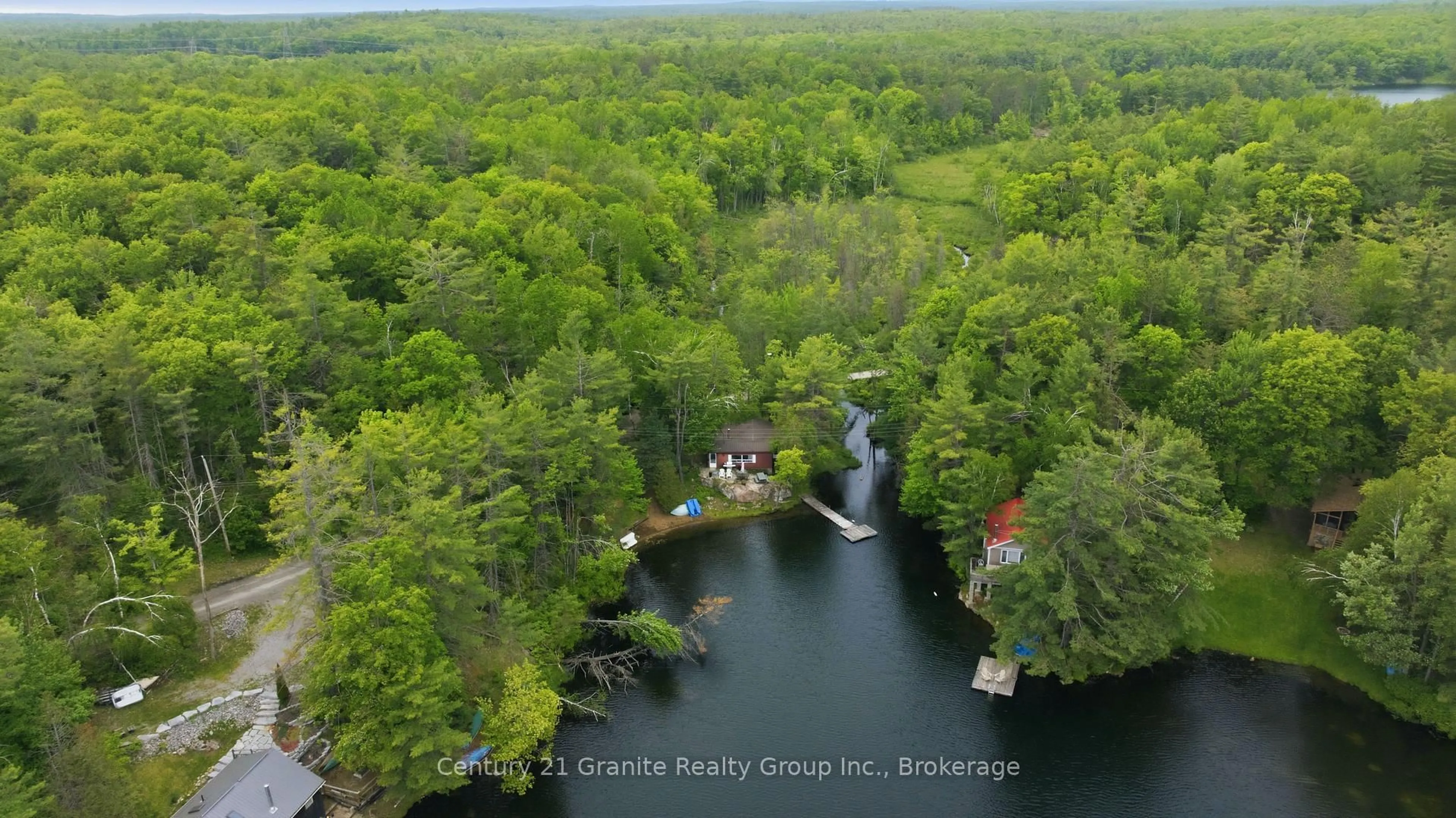 A pic from outside/outdoor area/front of a property/back of a property/a pic from drone, water/lake/river/ocean view for 1427 Spar Lake Rd, Minden Hills Ontario K0M 2K0