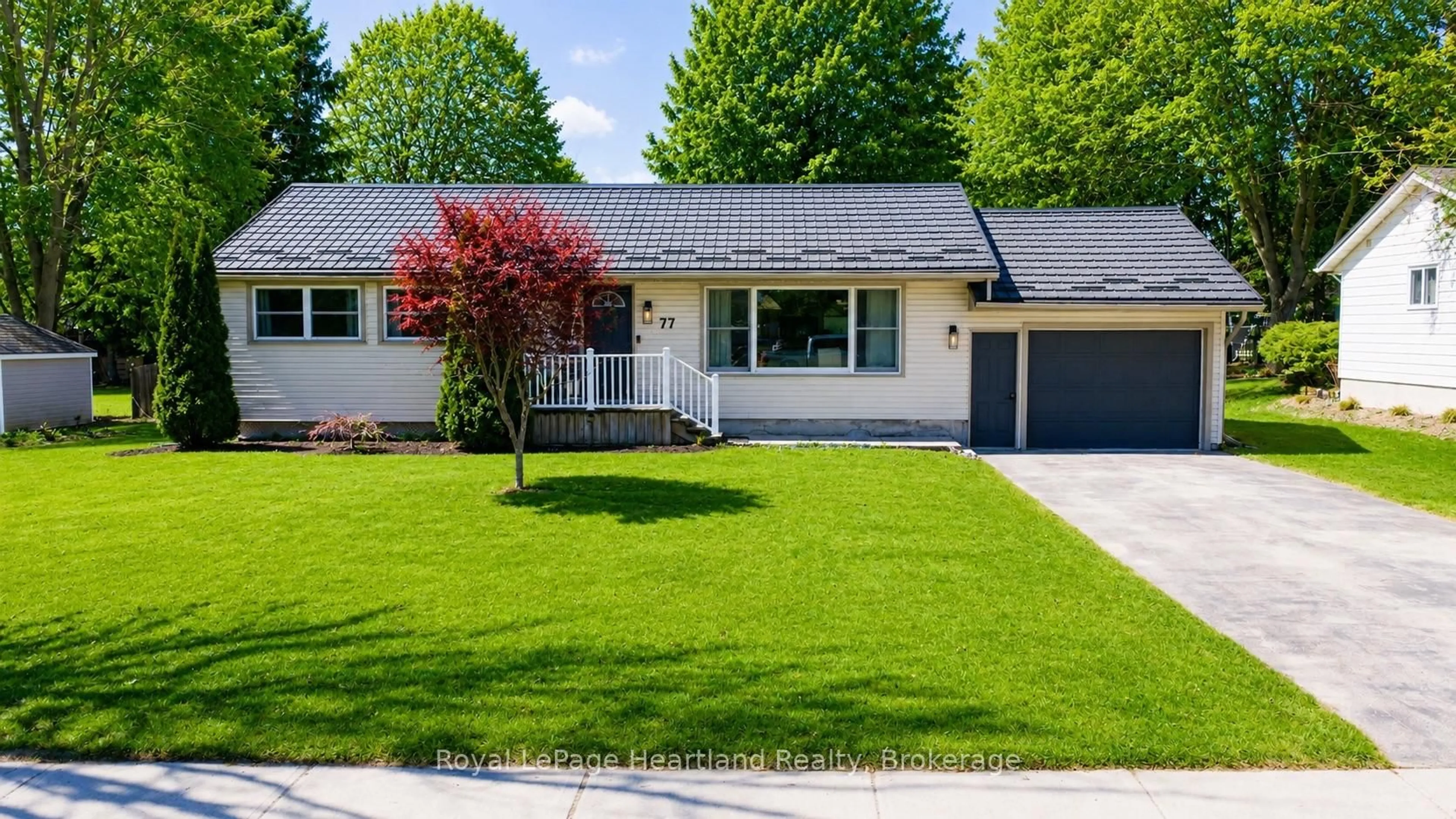 Home with vinyl exterior material, street for 77 Chalk St, Huron East Ontario N0K 1W0