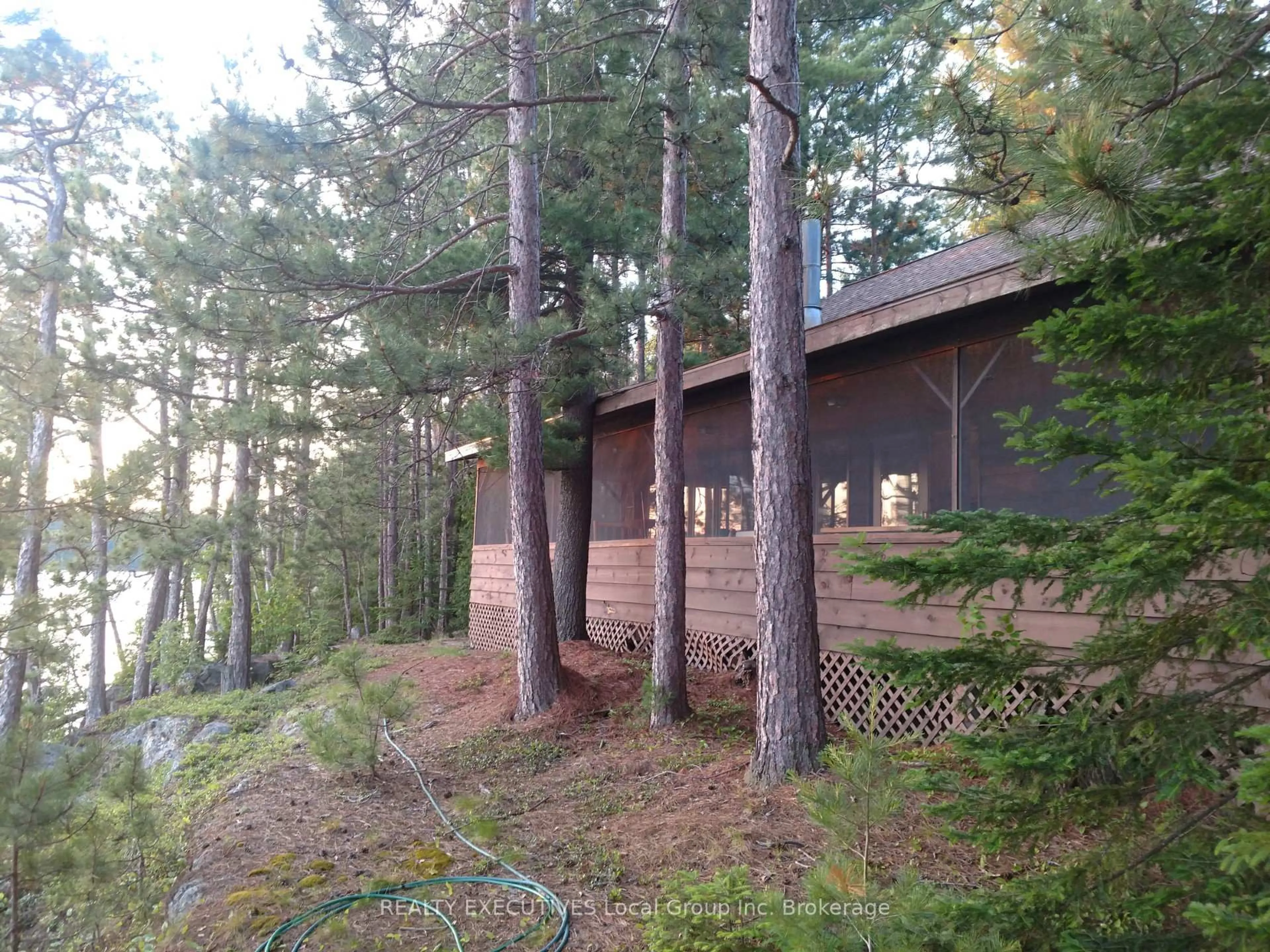 A pic from outside/outdoor area/front of a property/back of a property/a pic from drone, forest/trees view for 758 Island, Temagami Ontario P0H 2H0