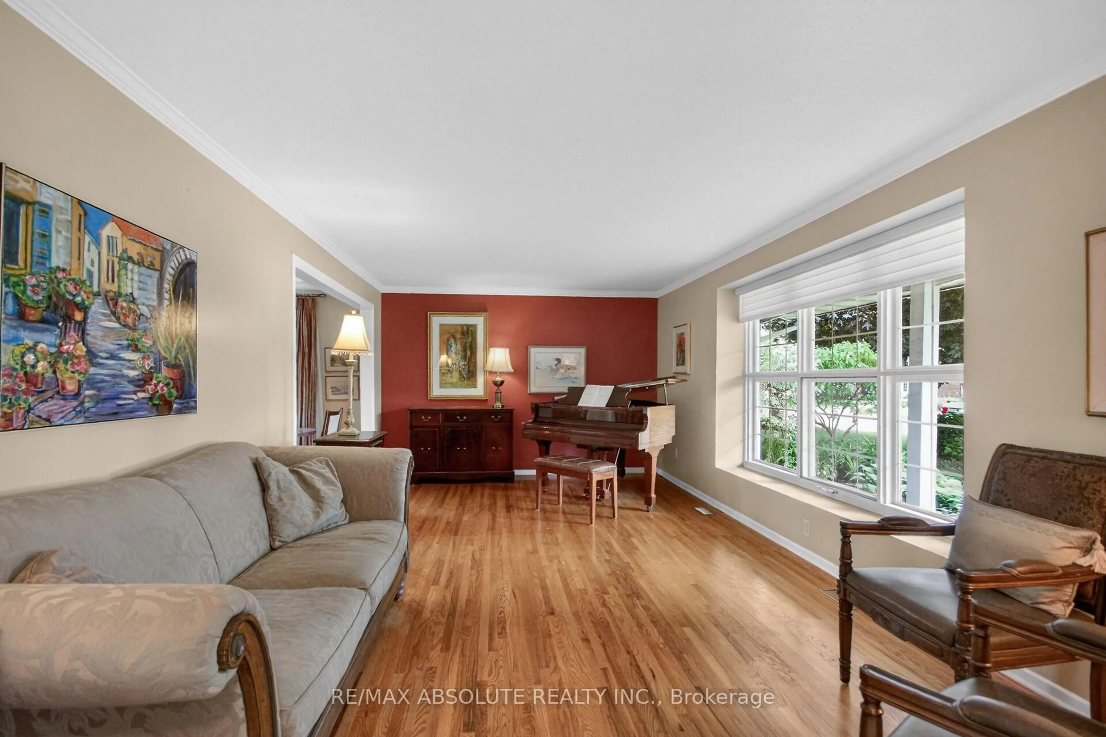 Living room with furniture, wood/laminate floor for 1953 Mulberry Cres, Ottawa Ontario K1J 8J8