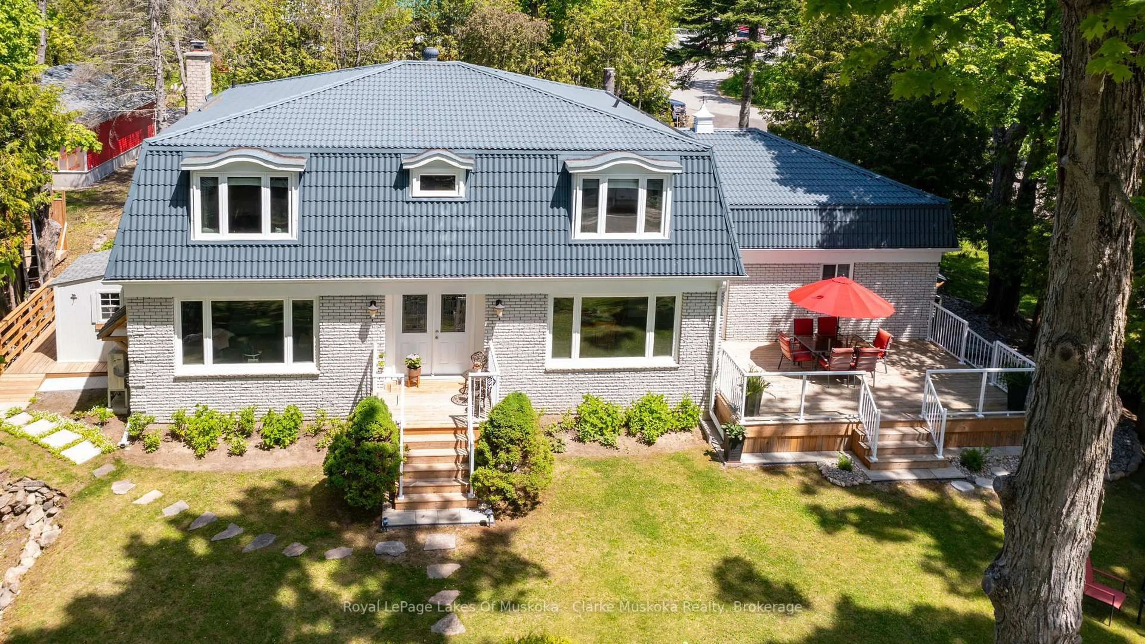 A pic from outside/outdoor area/front of a property/back of a property/a pic from drone, street for 1012 Mill St, Muskoka Lakes Ontario P0C 1A0