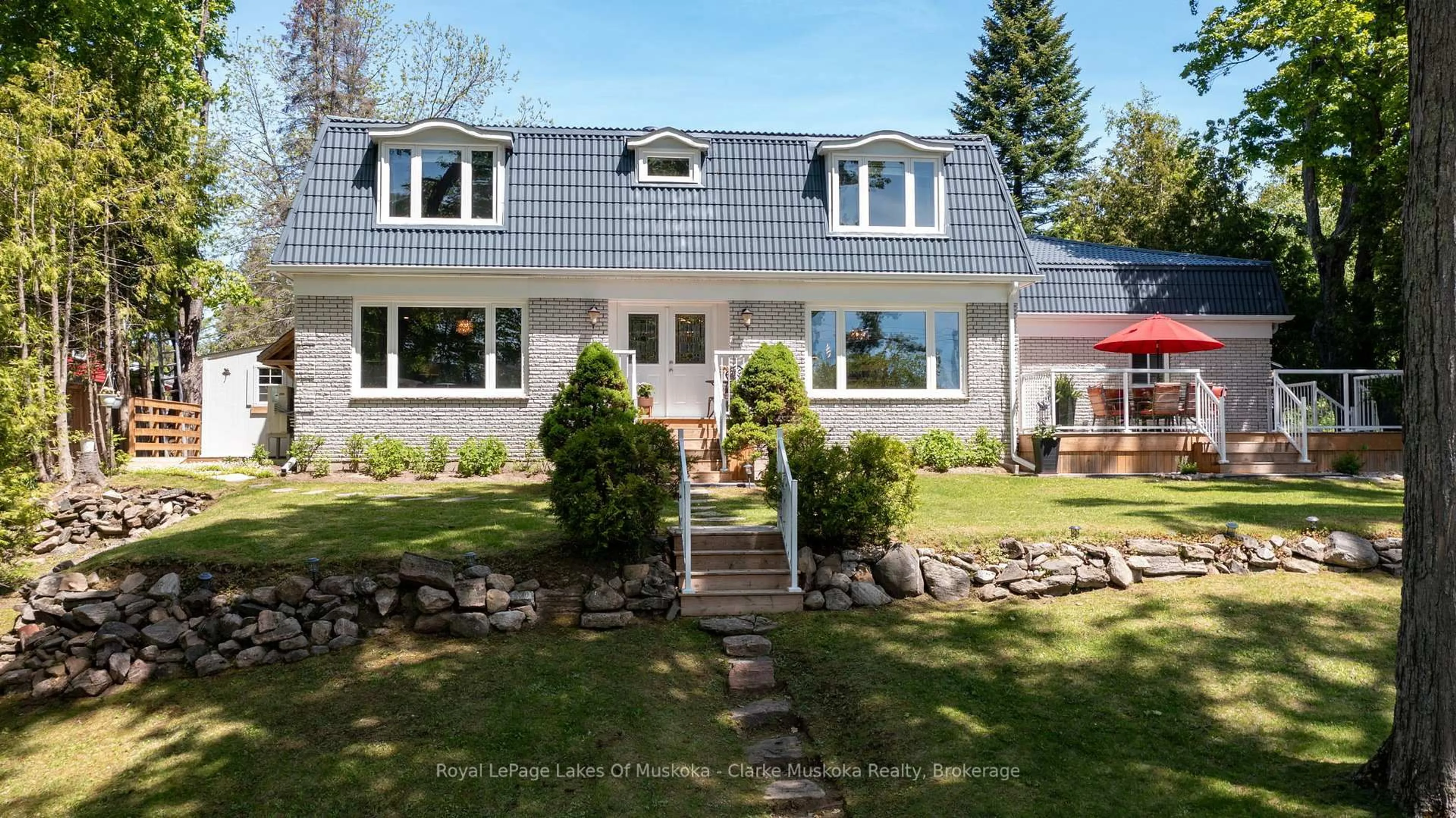 Home with vinyl exterior material, street for 1012 Mill St, Muskoka Lakes Ontario P0C 1A0