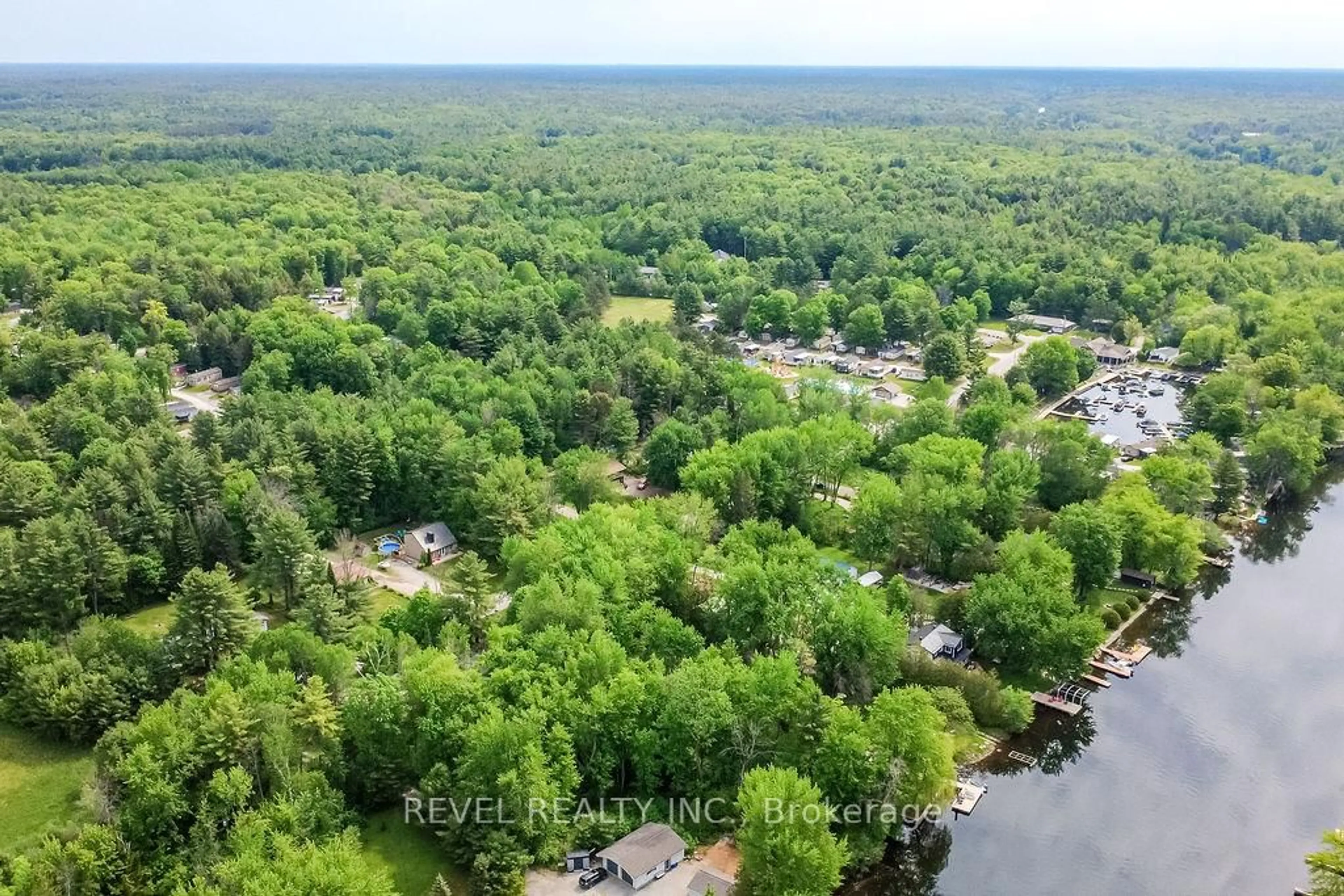 A pic from outside/outdoor area/front of a property/back of a property/a pic from drone, forest/trees view for 1112 Shamrock Marina Rd, Gravenhurst Ontario P0E 1N0