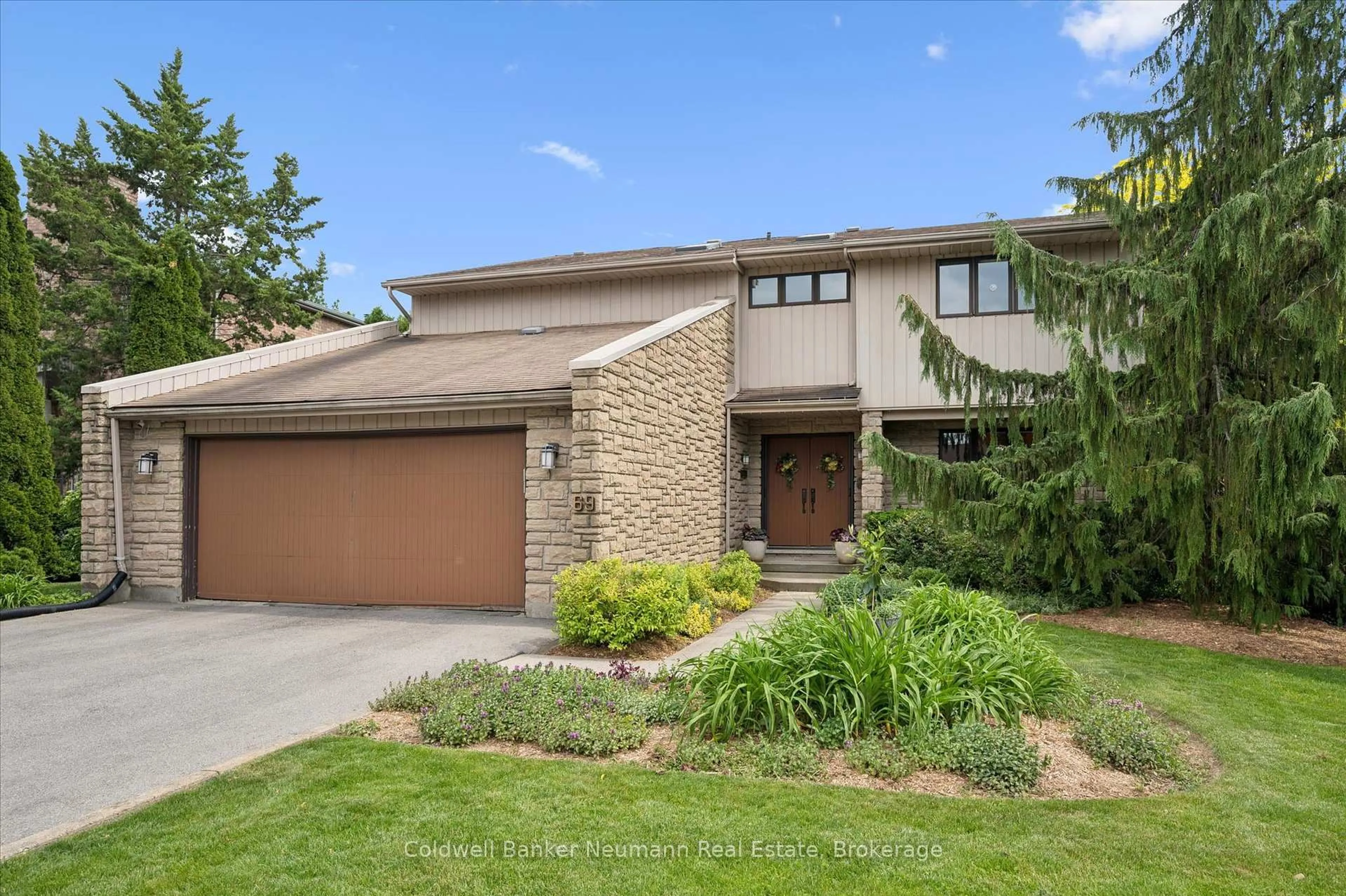 Home with brick exterior material, street for 69 Woodland Glen Dr, Guelph Ontario N1G 3S3