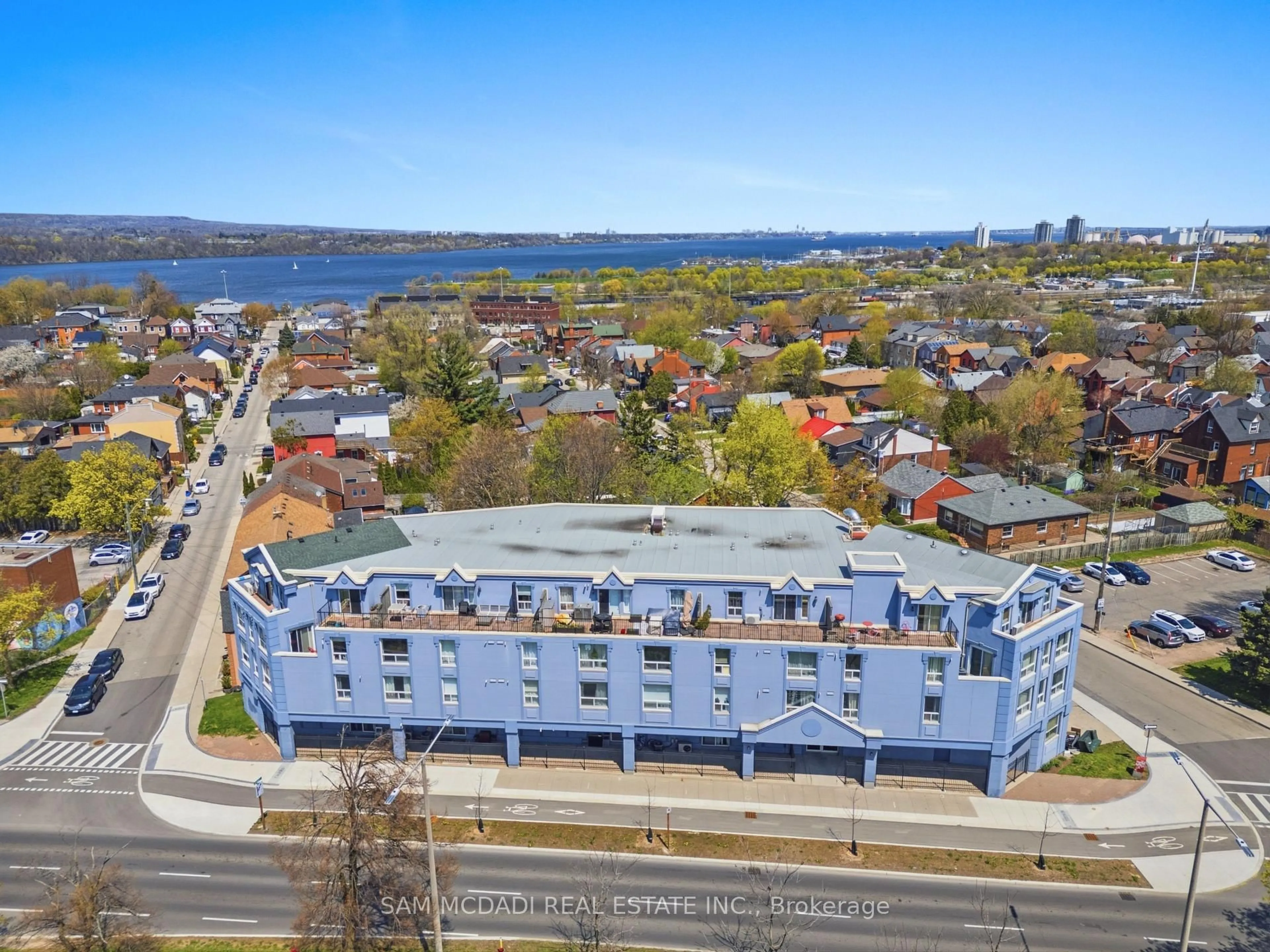 A pic from outside/outdoor area/front of a property/back of a property/a pic from drone, water/lake/river/ocean view for 400 York Blvd #201, Hamilton Ontario L8R 3M5