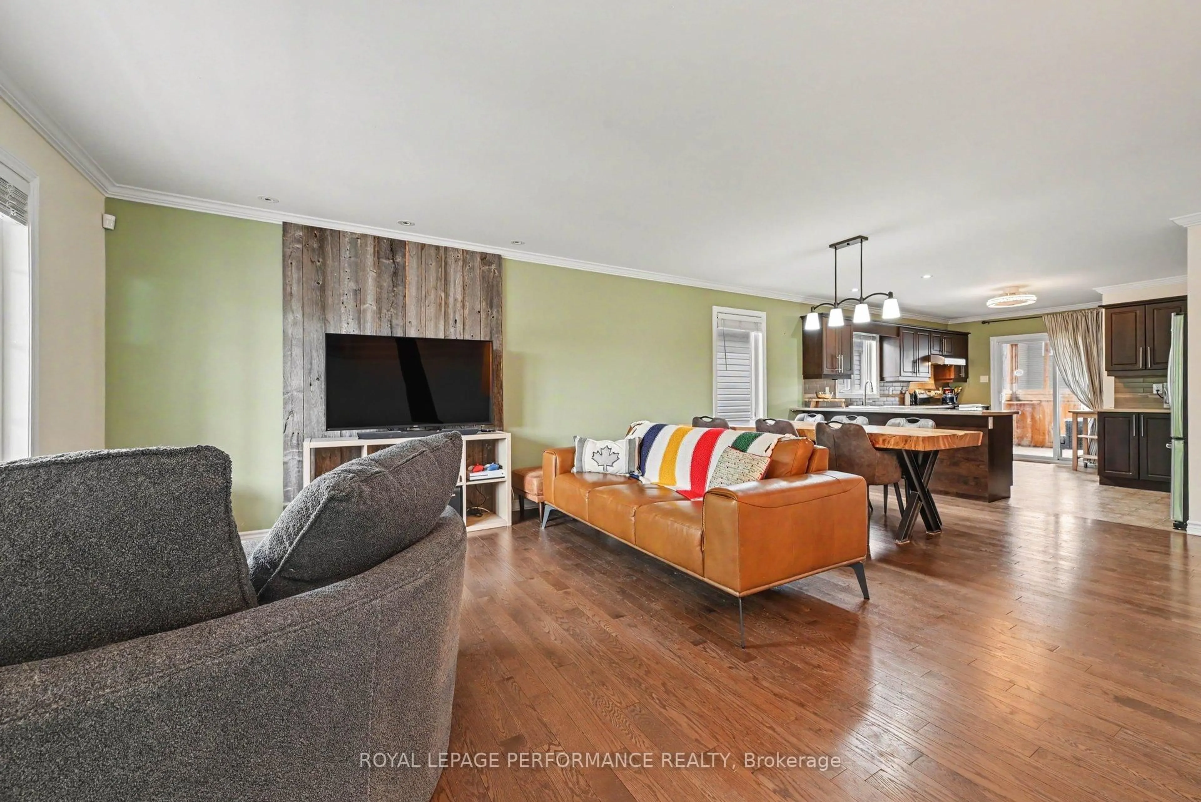 Living room with furniture, wood/laminate floor for 71 Mayer St, The Nation Ontario K0A 2M0