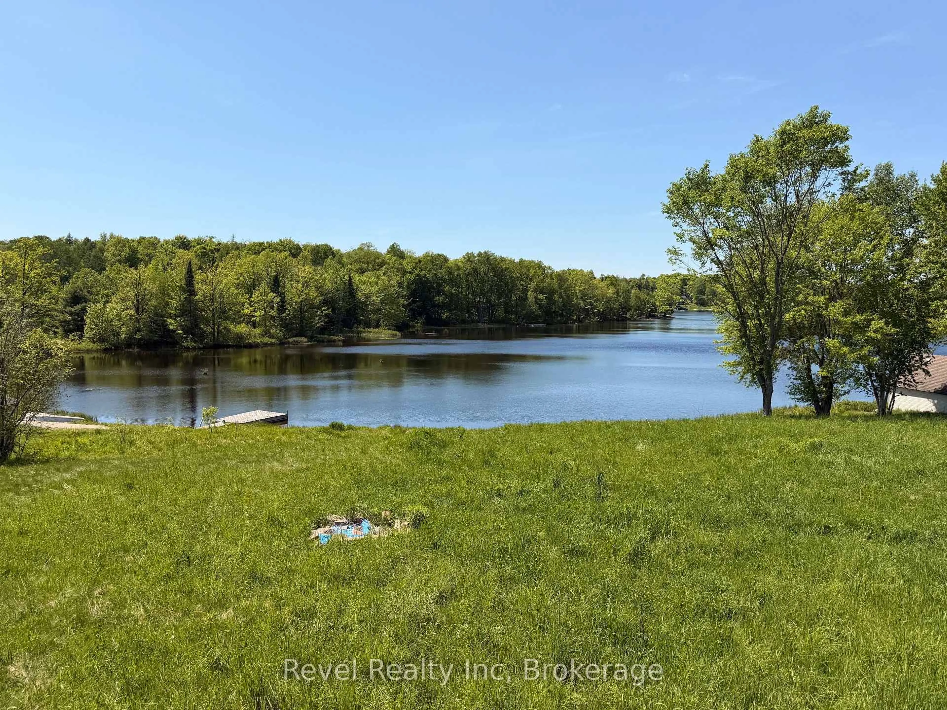 A pic from outside/outdoor area/front of a property/back of a property/a pic from drone, water/lake/river/ocean view for 64 Jones Rd, McKellar Ontario P2A 2W7