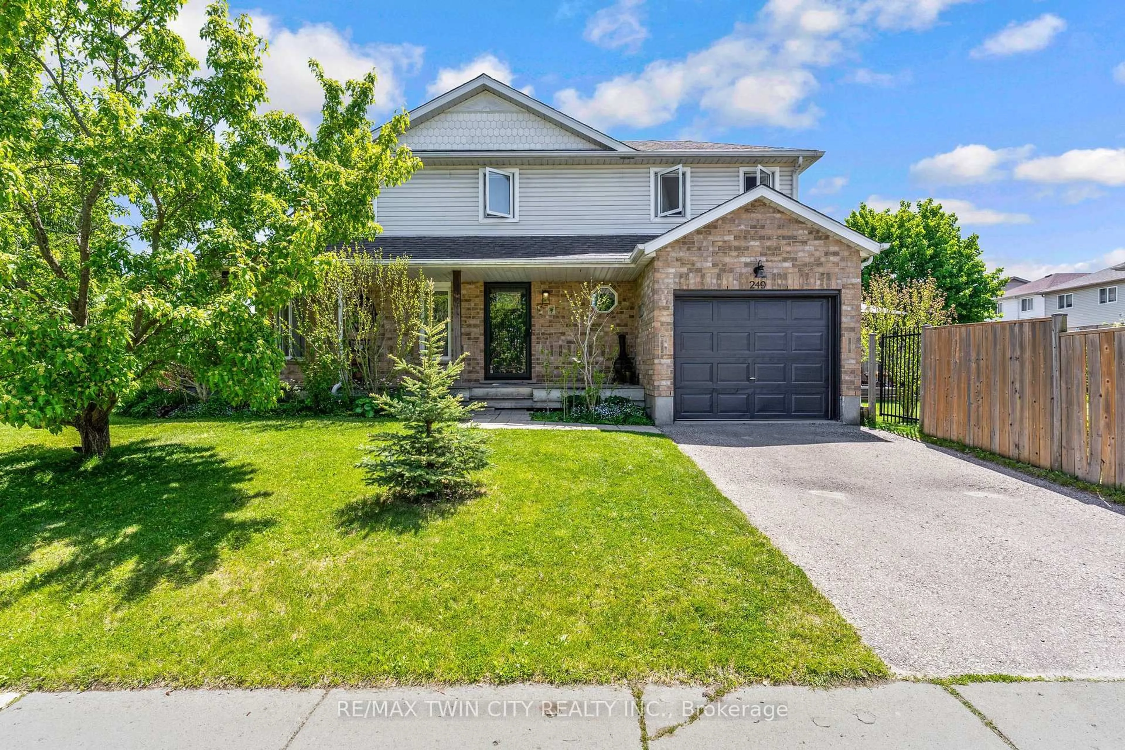 Home with brick exterior material, street for 249 Wilderness Dr, Kitchener Ontario N2E 3R4