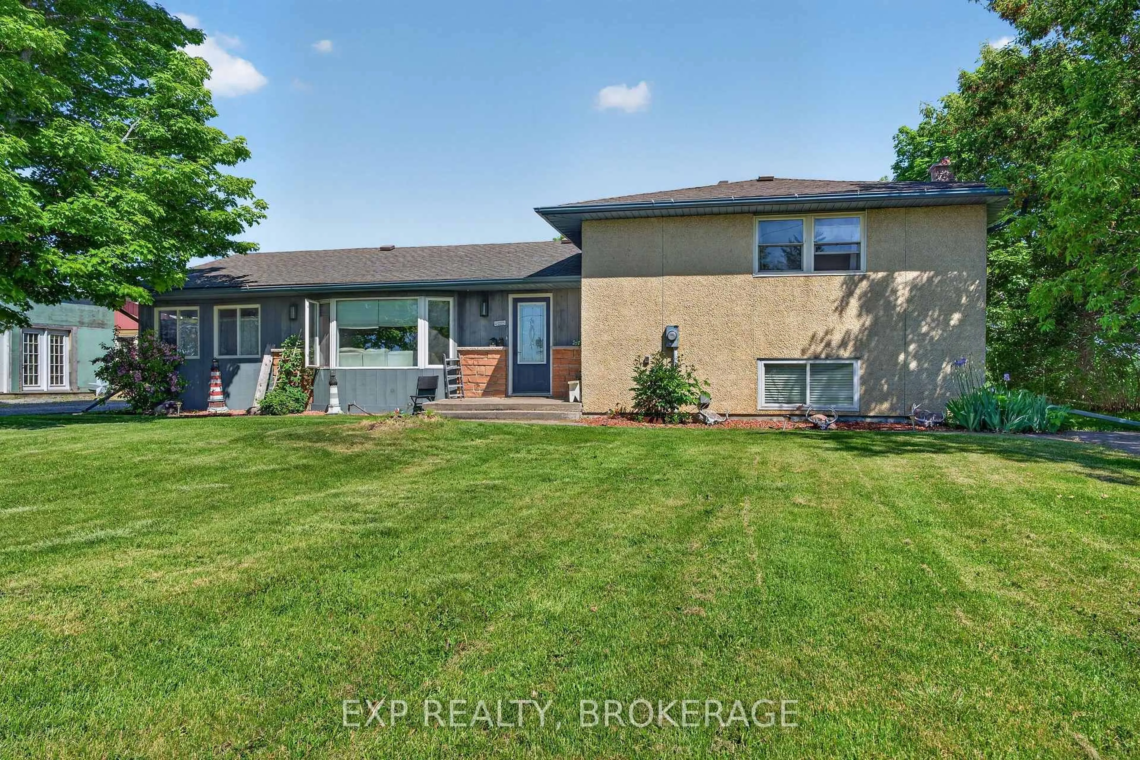 A pic from outside/outdoor area/front of a property/back of a property/a pic from drone, street for 2214 HIGHWAY 96, Wolfe Island Ontario K0H 2Y0