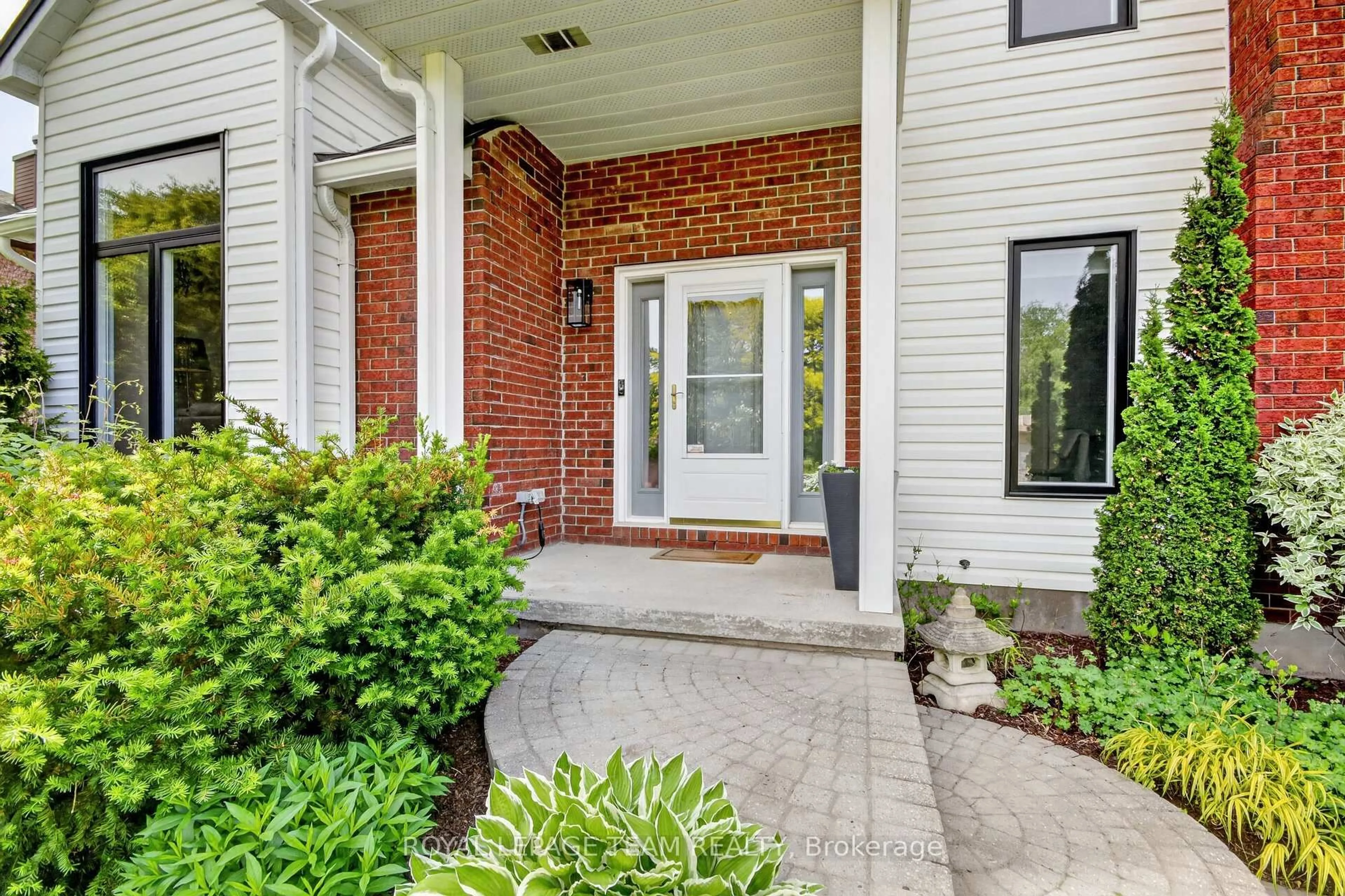 Home with brick exterior material, street for 7116 QUINNFIELD Way, Greely Ontario K4P 1B6