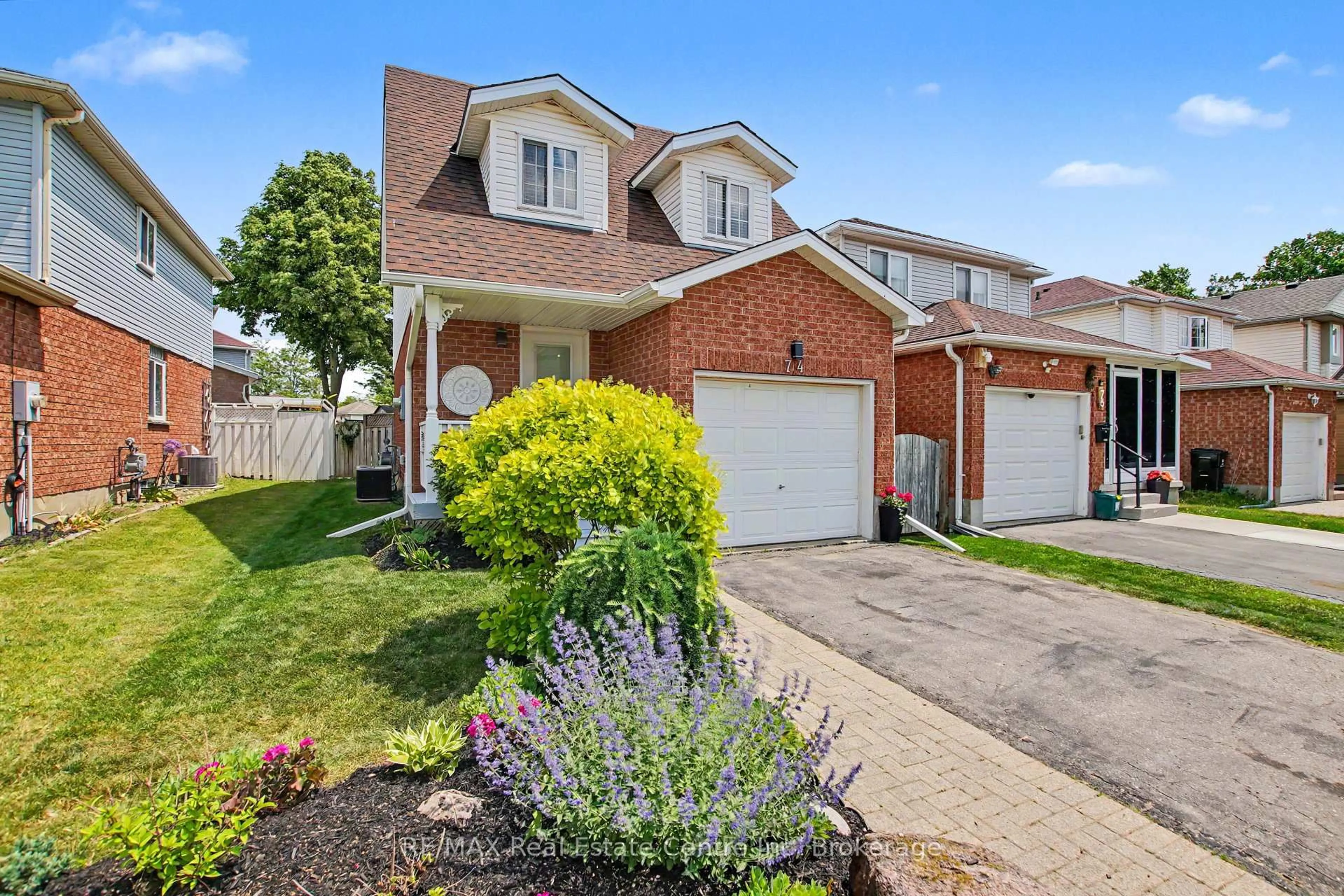 Home with brick exterior material, street for 74 Activa Ave, Kitchener Ontario N2E 3R4