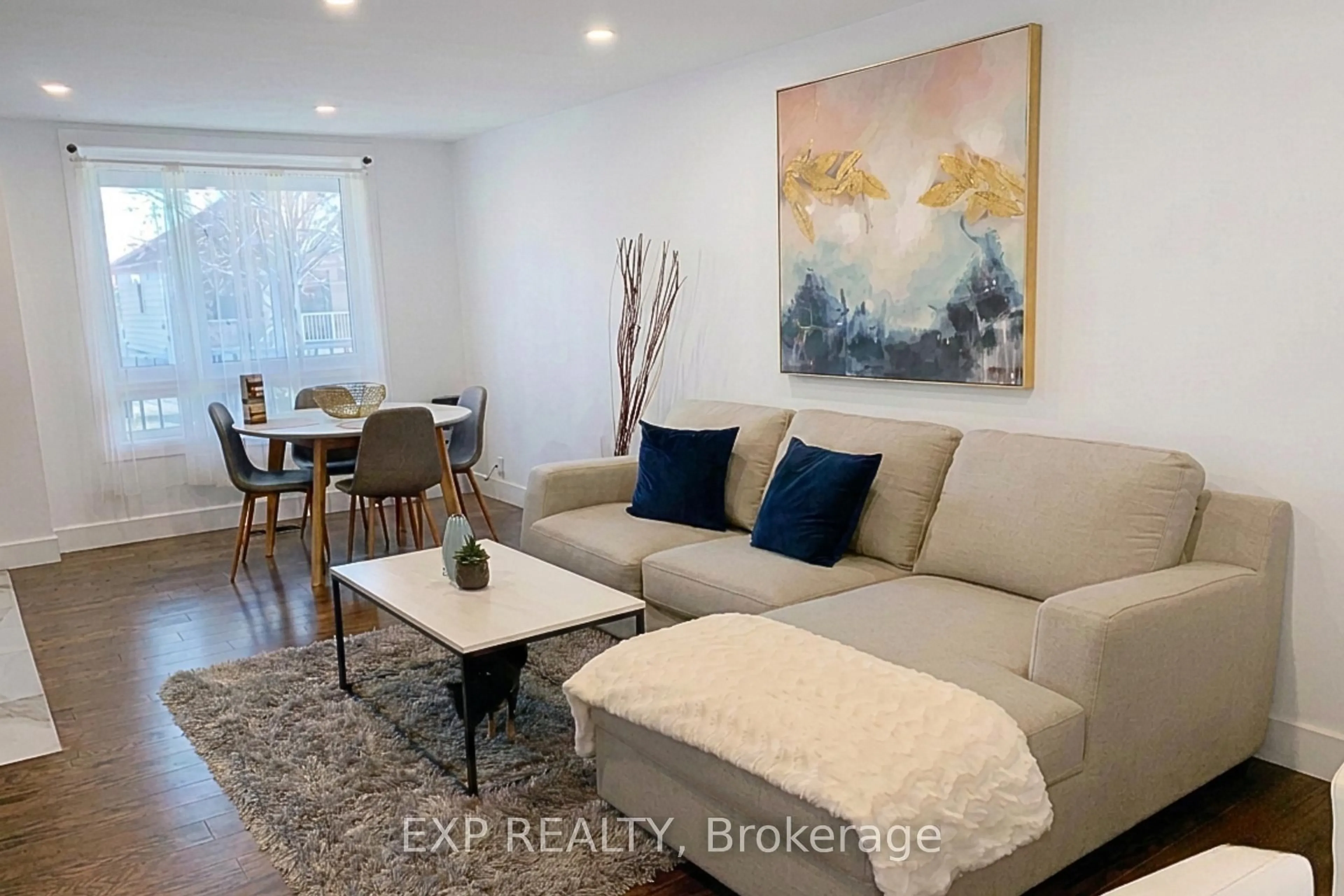 Living room with furniture, wood/laminate floor for 323 Montfort St, Ottawa Ontario K1L 5N5