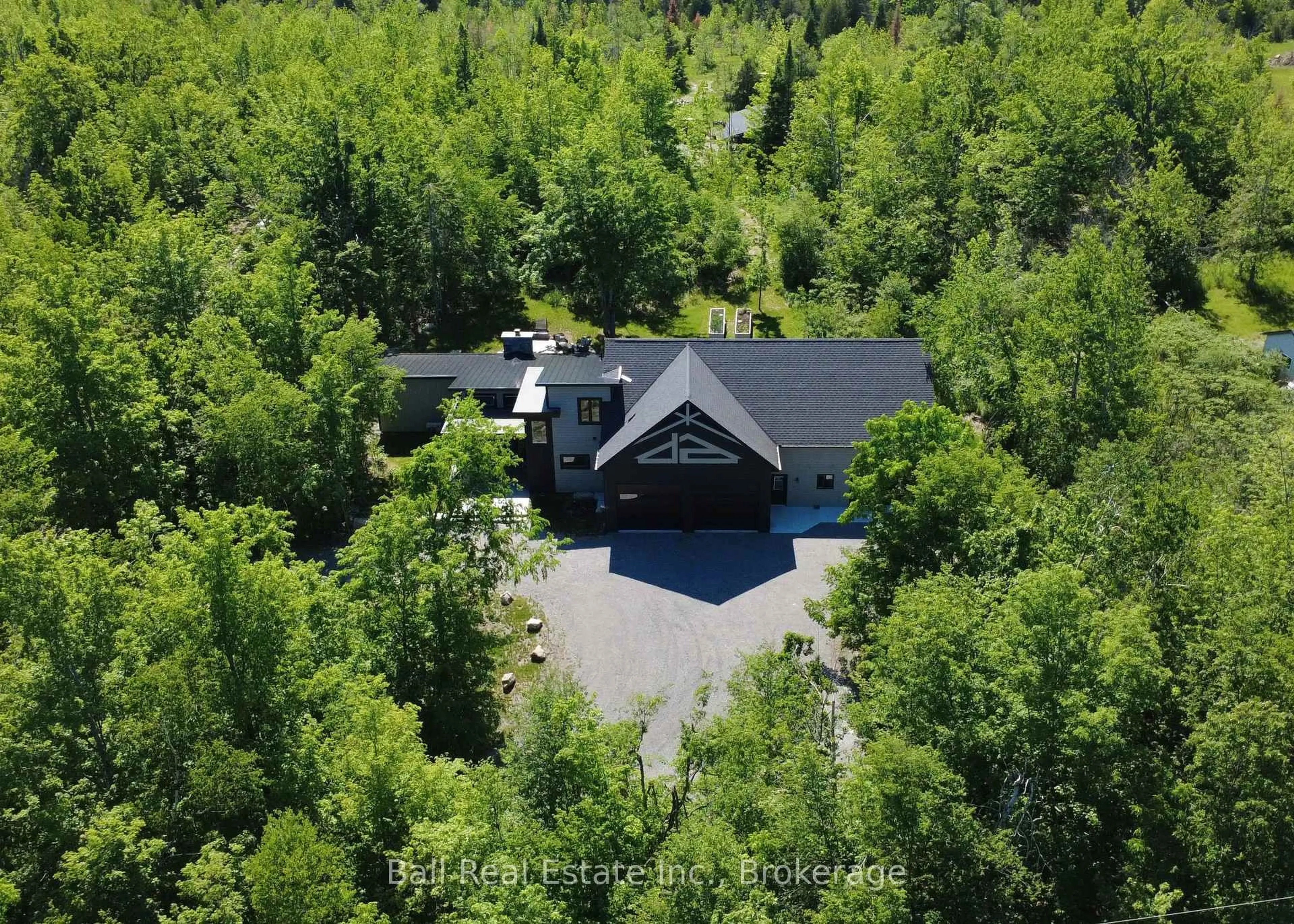 A pic from outside/outdoor area/front of a property/back of a property/a pic from drone, forest/trees view for 33 LAPLANTES Rd, Trent Lakes Ontario K0L 1J0