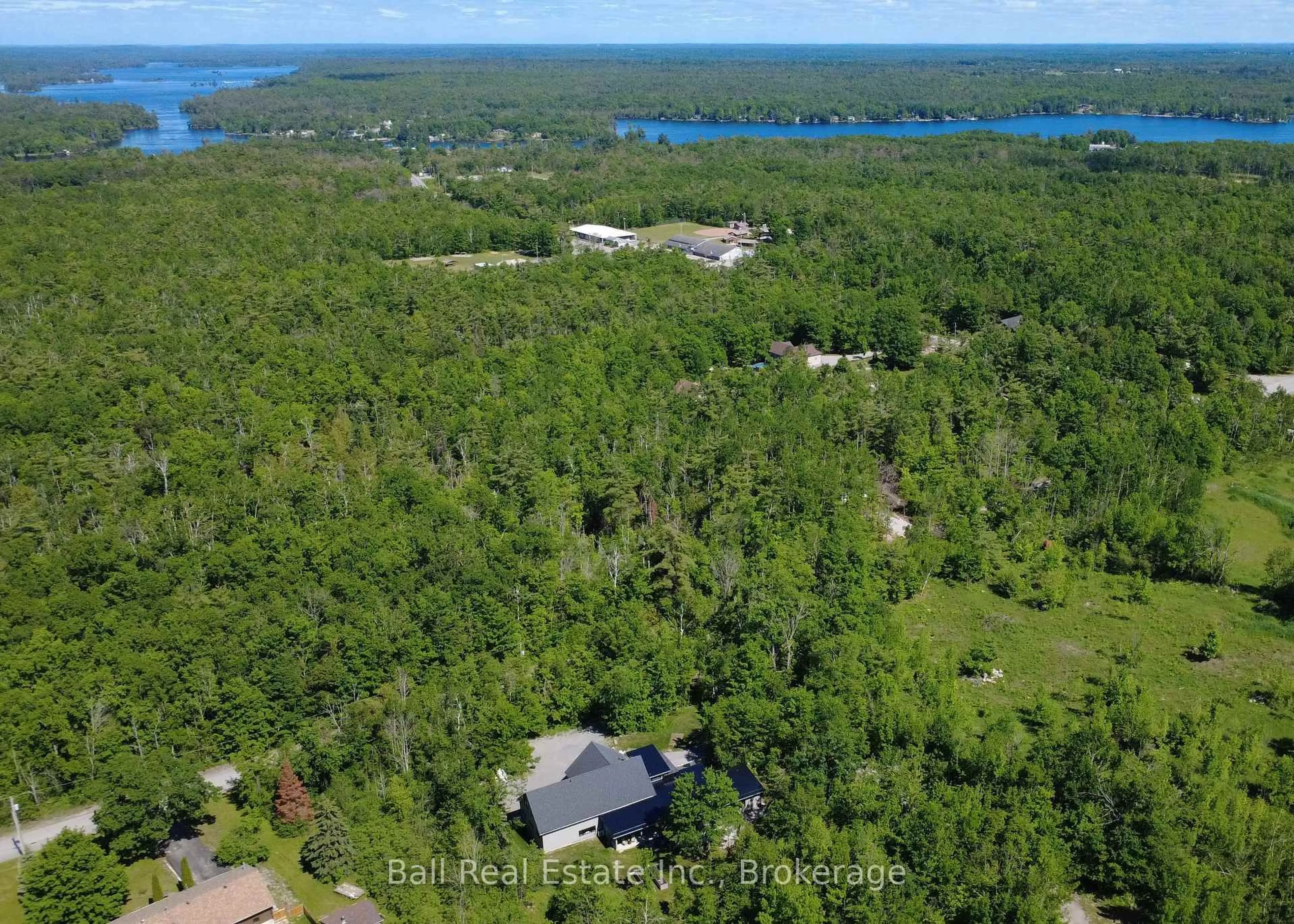 A pic from outside/outdoor area/front of a property/back of a property/a pic from drone, water/lake/river/ocean view for 33 LAPLANTES Rd, Trent Lakes Ontario K0L 1J0