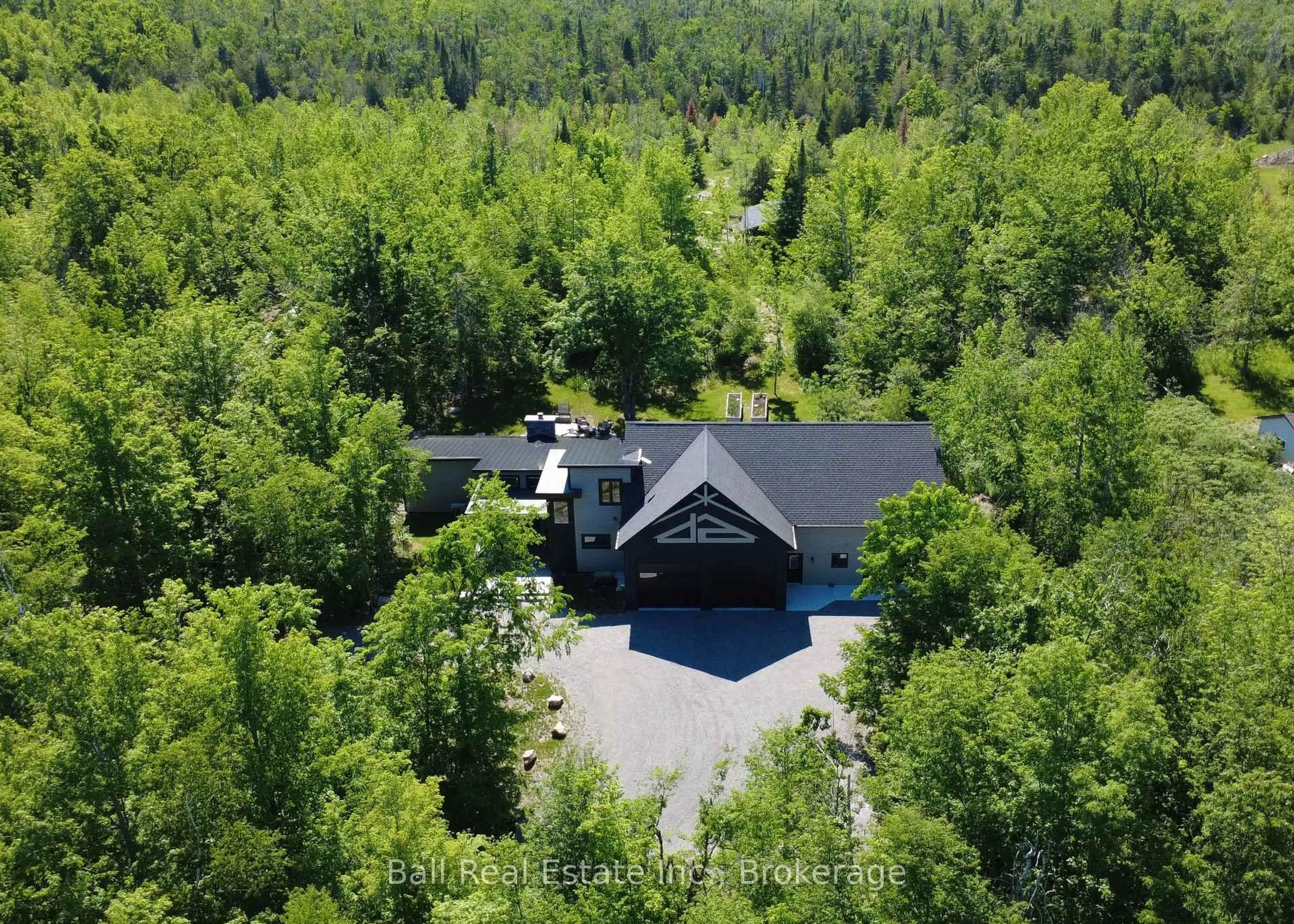 A pic from outside/outdoor area/front of a property/back of a property/a pic from drone, forest/trees view for 33 LAPLANTES Rd, Trent Lakes Ontario K0L 1J0