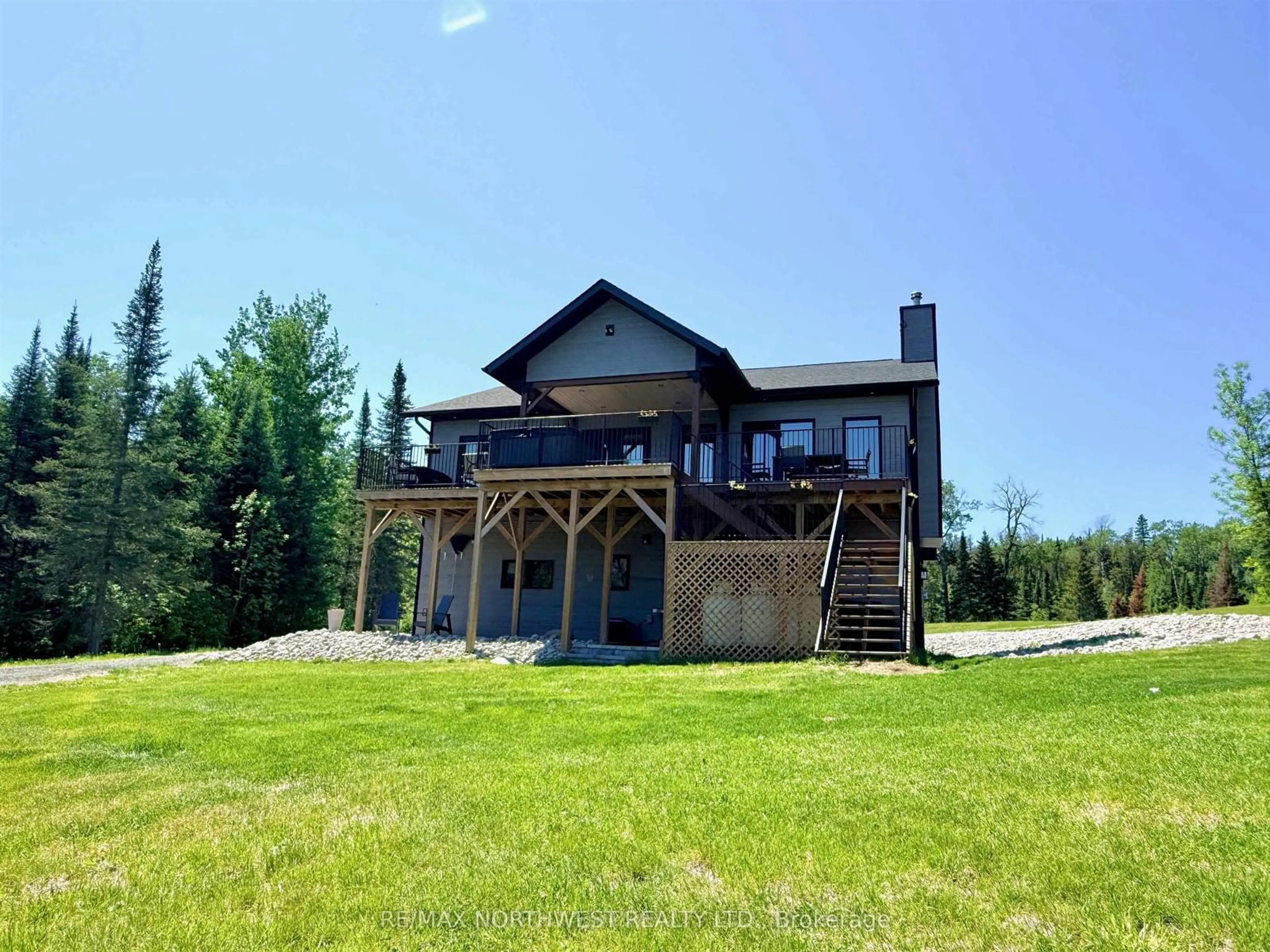 A pic from outside/outdoor area/front of a property/back of a property/a pic from drone, water/lake/river/ocean view for 340 Bruckenburger Rd, Kenora Ontario P9N 0E3