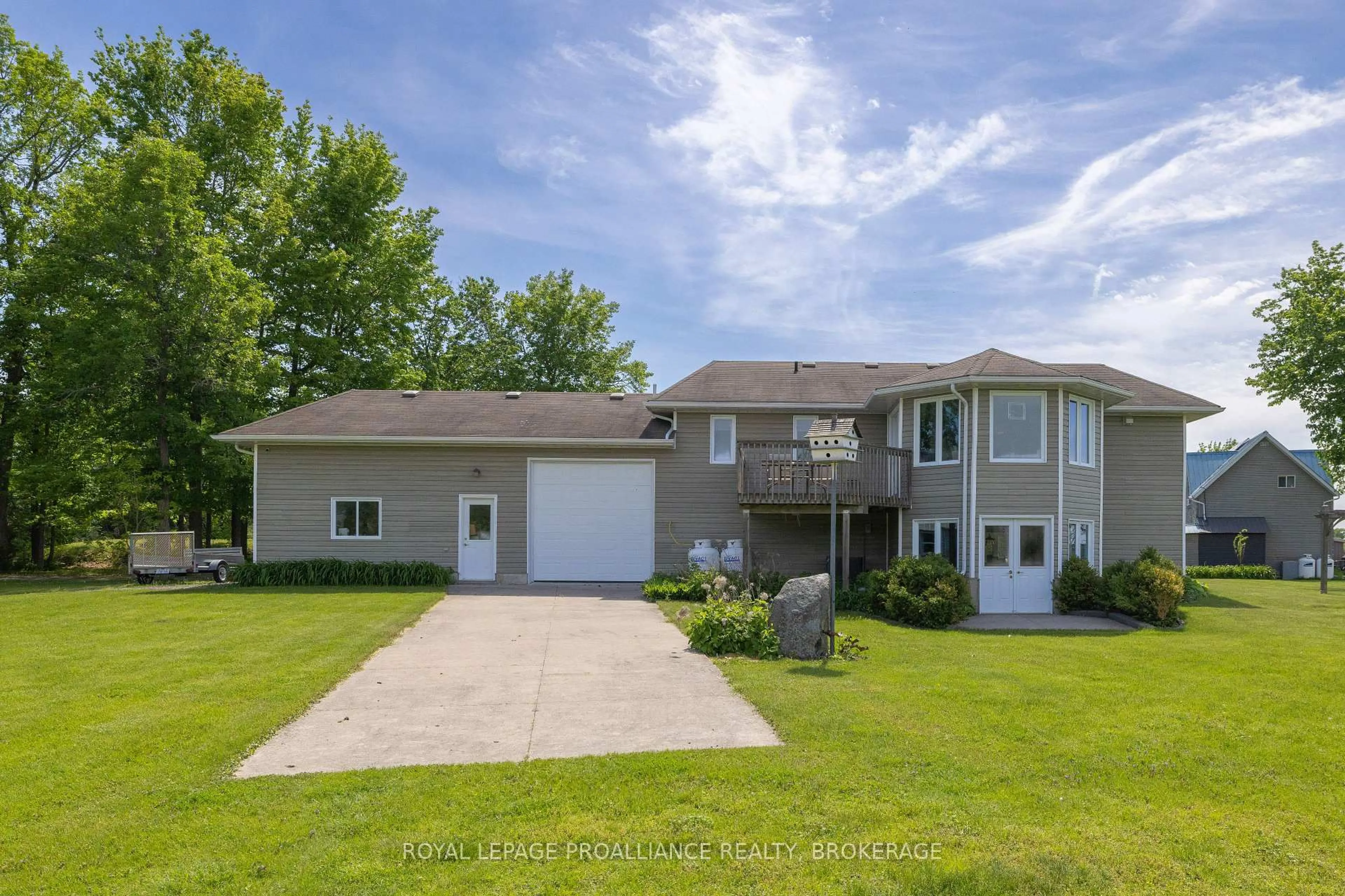 A pic from outside/outdoor area/front of a property/back of a property/a pic from drone, water/lake/river/ocean view for 2318 15 Highway, Kingston Ontario K7L 4V3