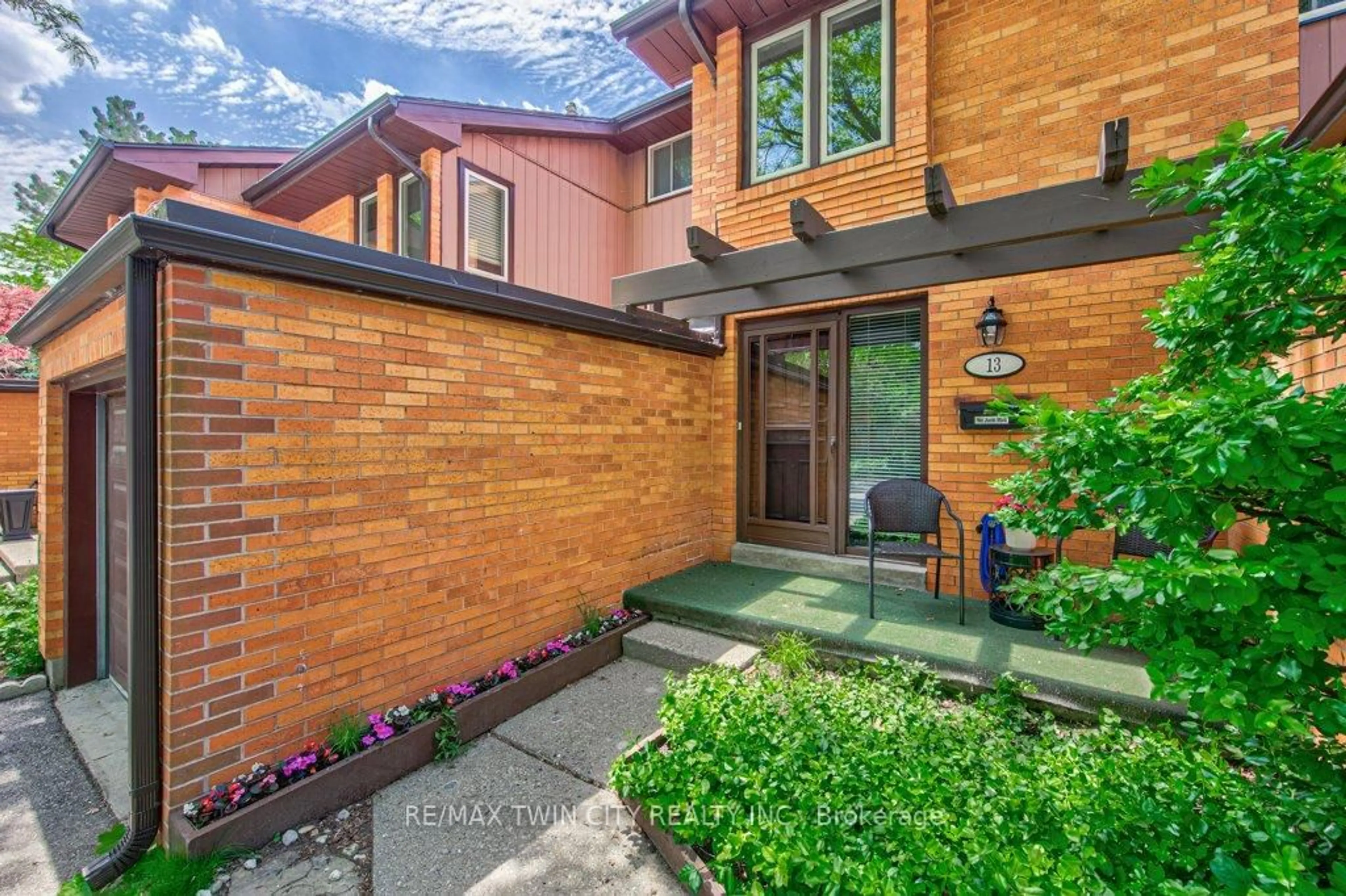 Home with brick exterior material, street for 206 Candlewood Cres #13, Waterloo Ontario N2L 5Y9