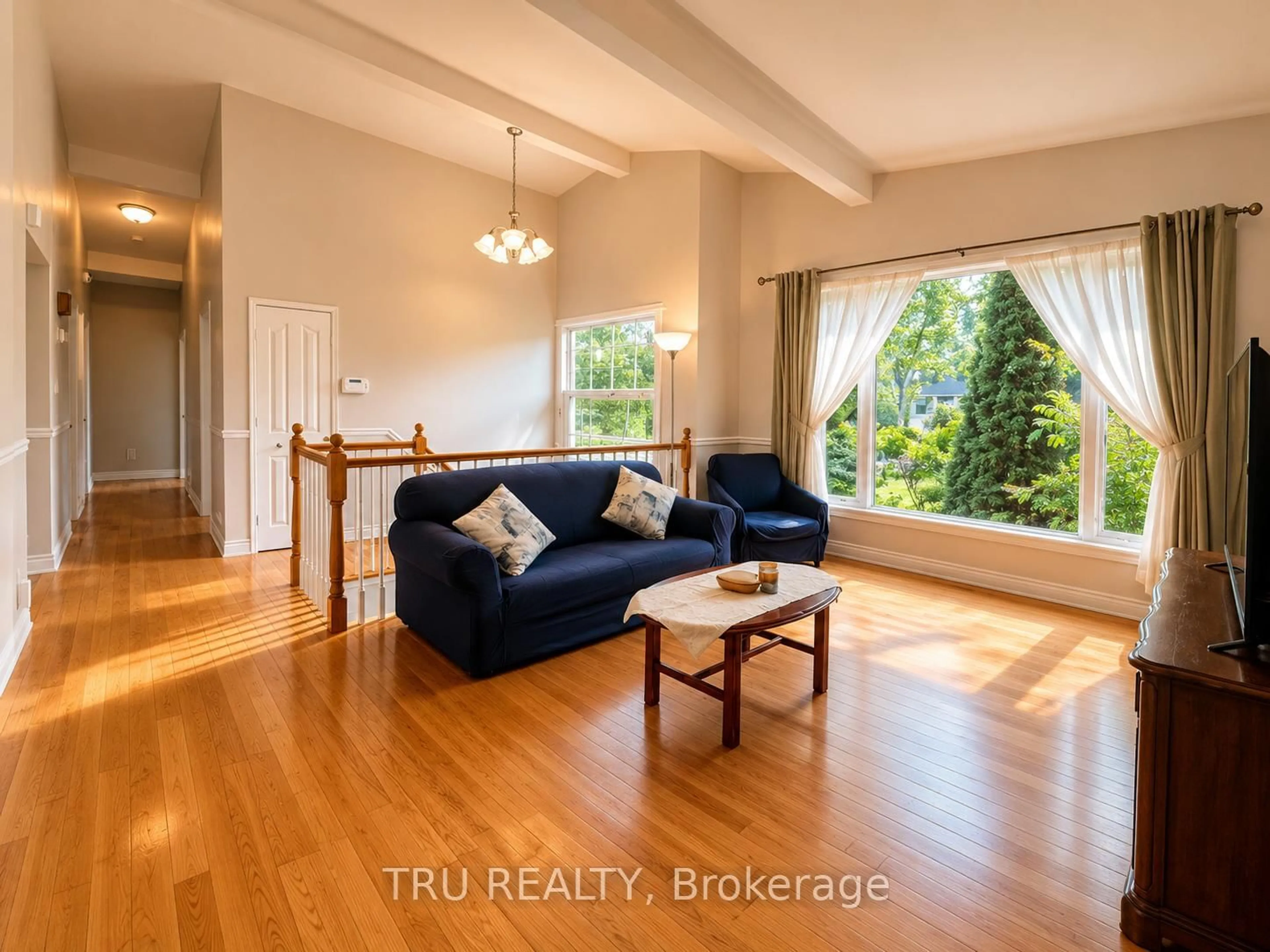 Living room with furniture, wood/laminate floor for 2422 Ouellette Rd, Clarence-Rockland Ontario K0A 3N0
