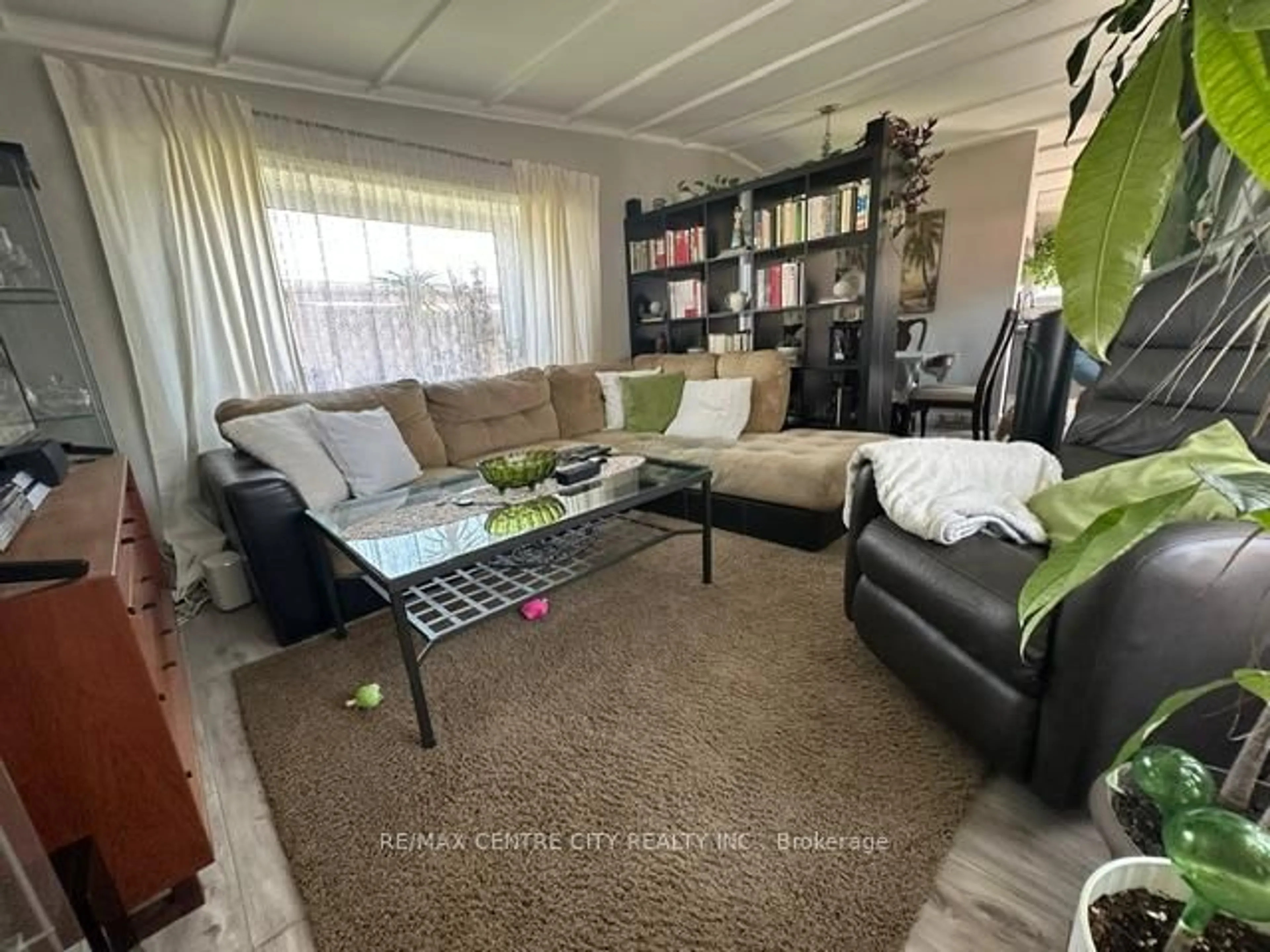 Living room with furniture, wood/laminate floor for 2189 Dundas St #41, London East Ontario N5V 1H3