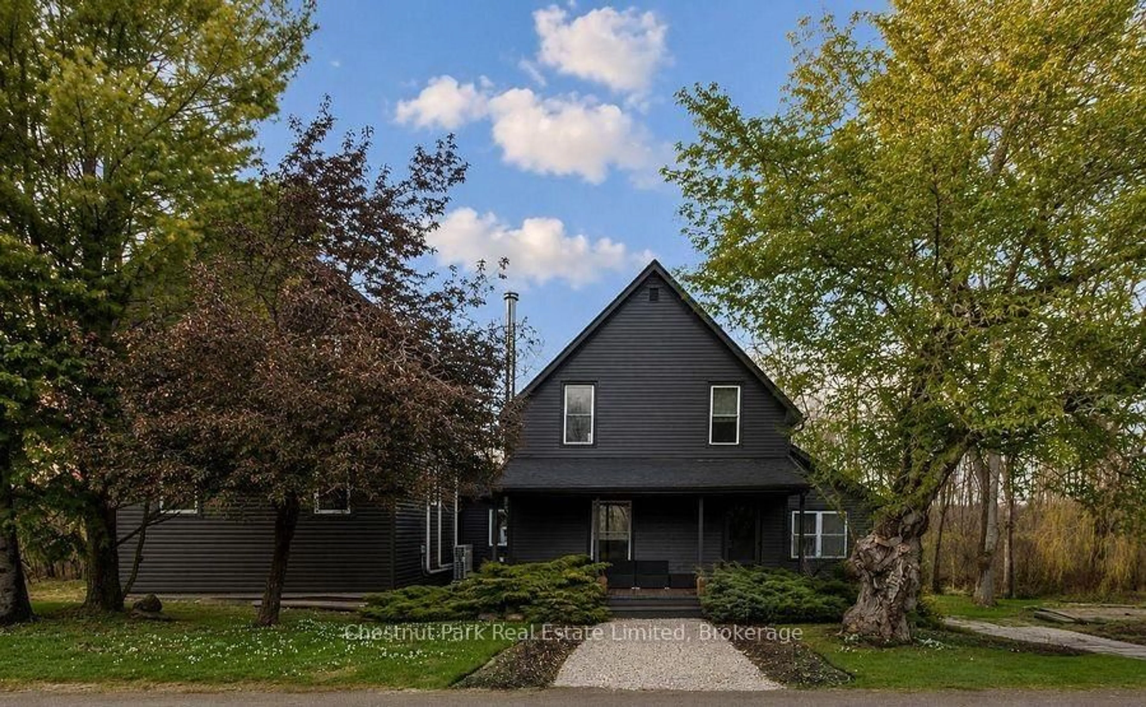 Home with vinyl exterior material, street for 709 Old Milford Rd, Prince Edward County Ontario K0K 2T0
