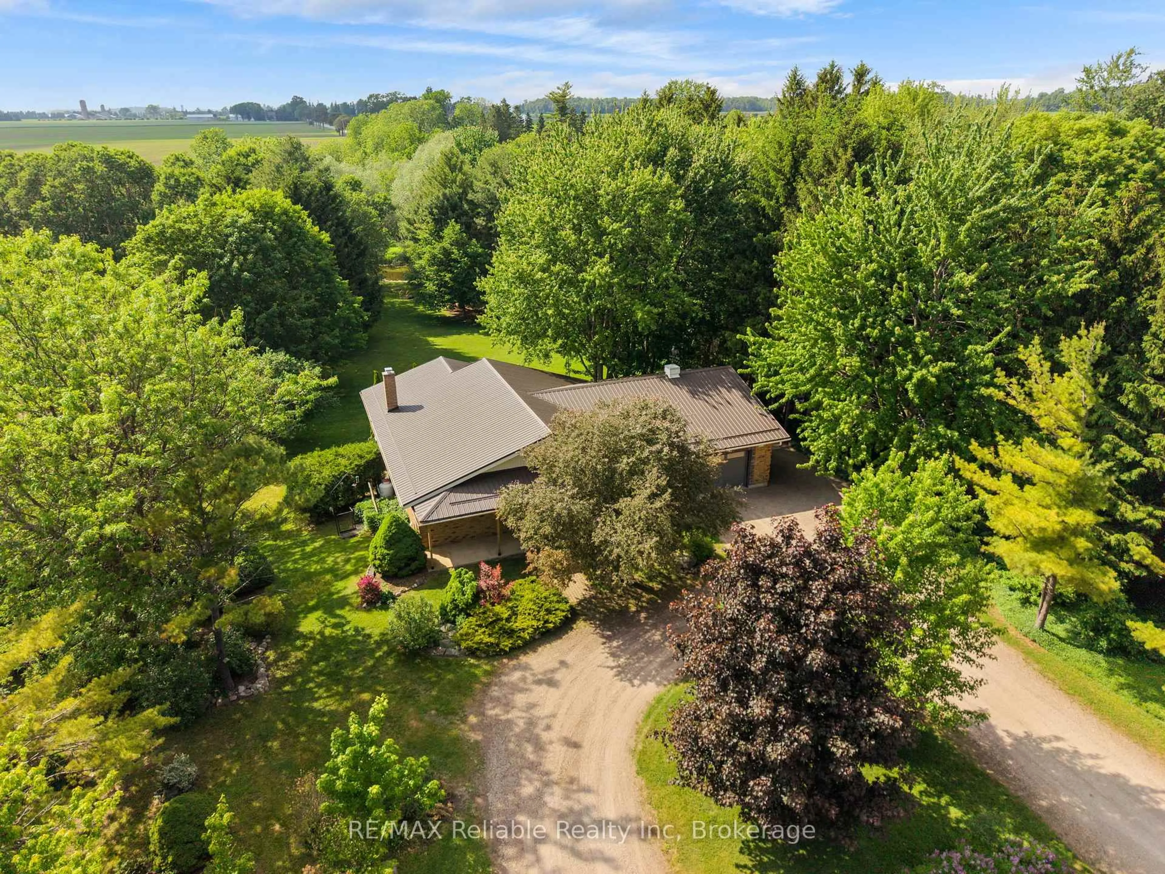 A pic from outside/outdoor area/front of a property/back of a property/a pic from drone, forest/trees view for 3396 Perth Road 130, Perth South Ontario N0K 1V0