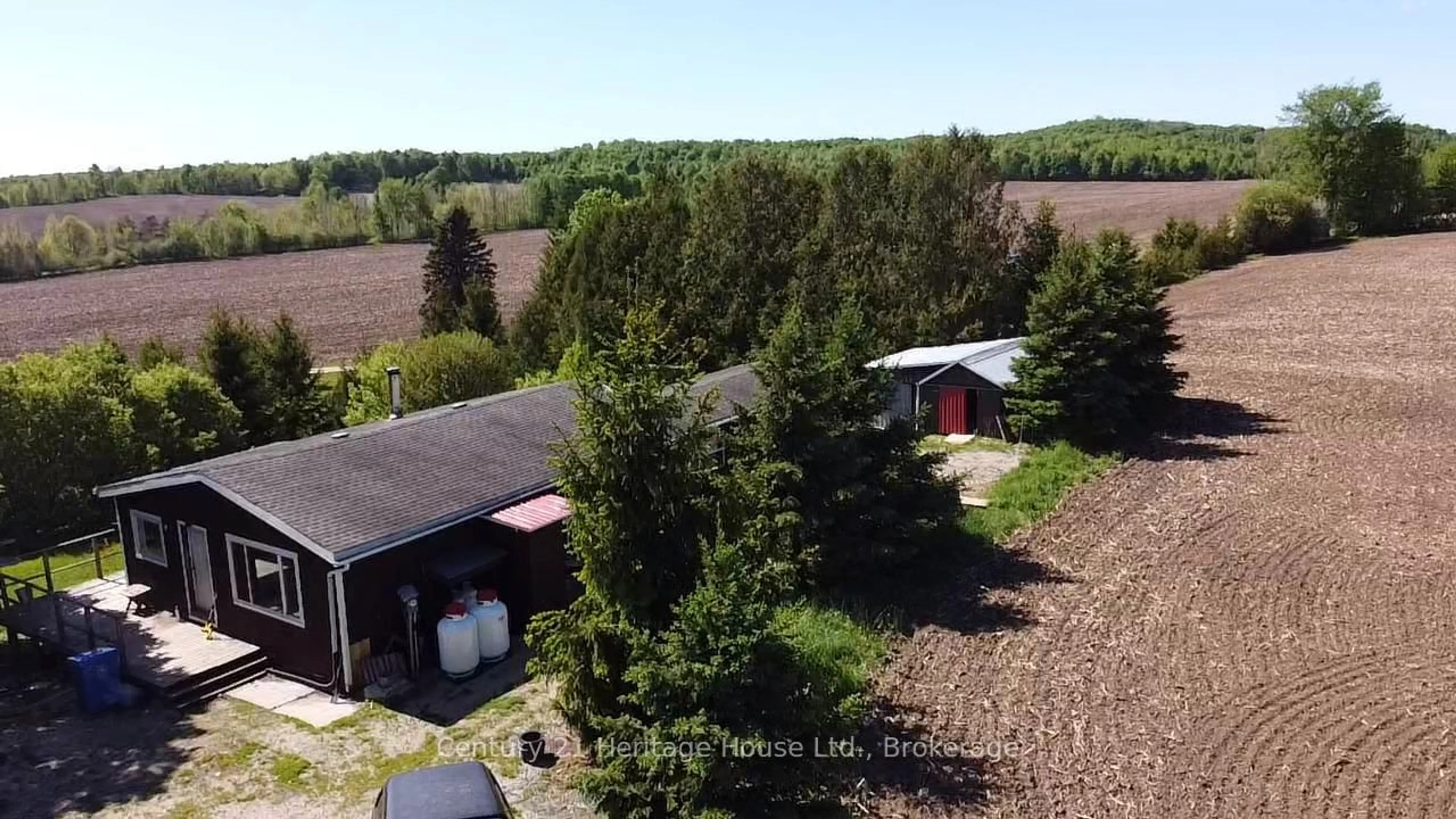 A pic from outside/outdoor area/front of a property/back of a property/a pic from drone, forest/trees view for 522241 Concession 12, West Grey Ontario N0G 1S0