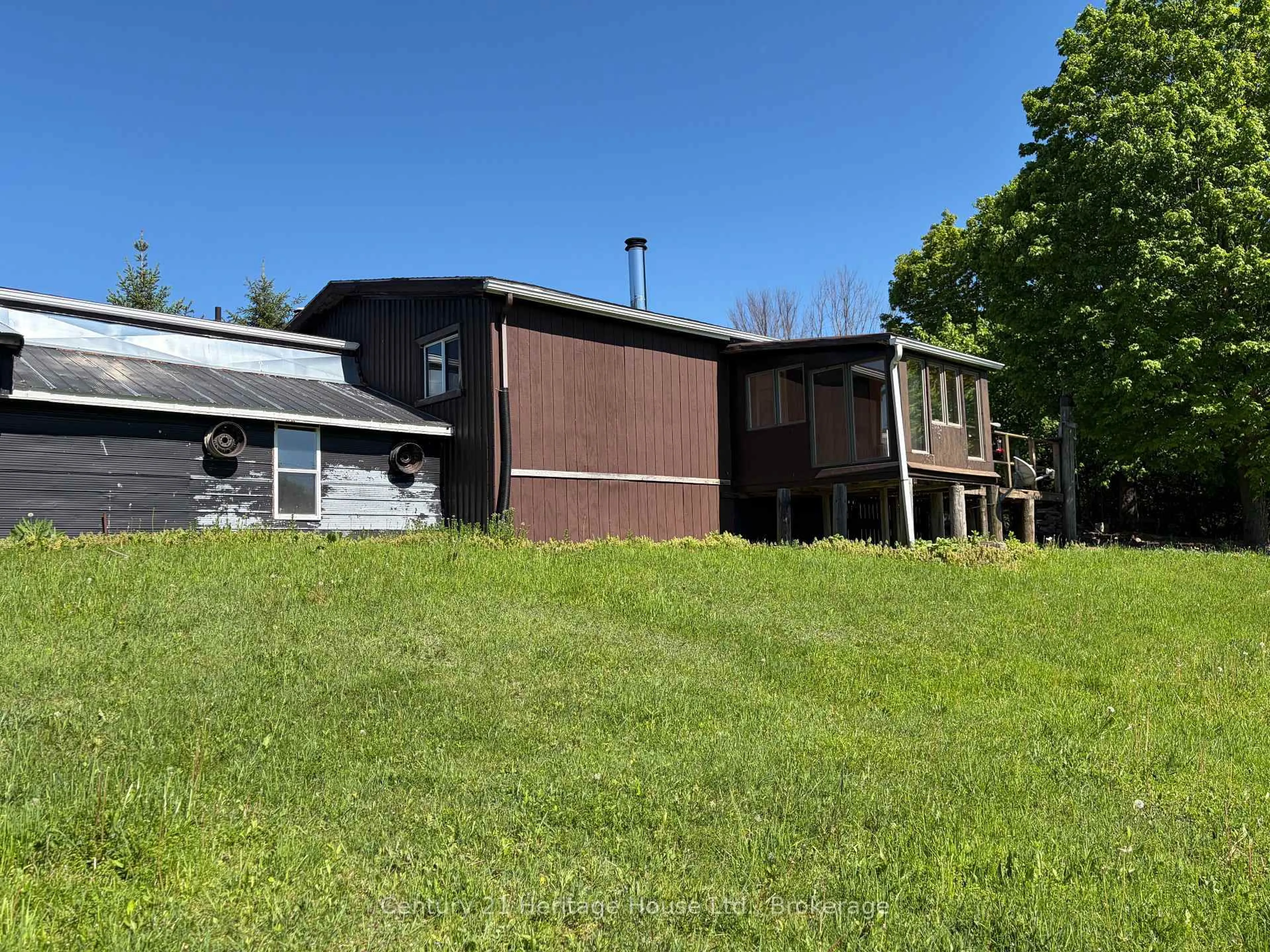 A pic from outside/outdoor area/front of a property/back of a property/a pic from drone, unknown for 522241 Concession 12, West Grey Ontario N0G 1S0