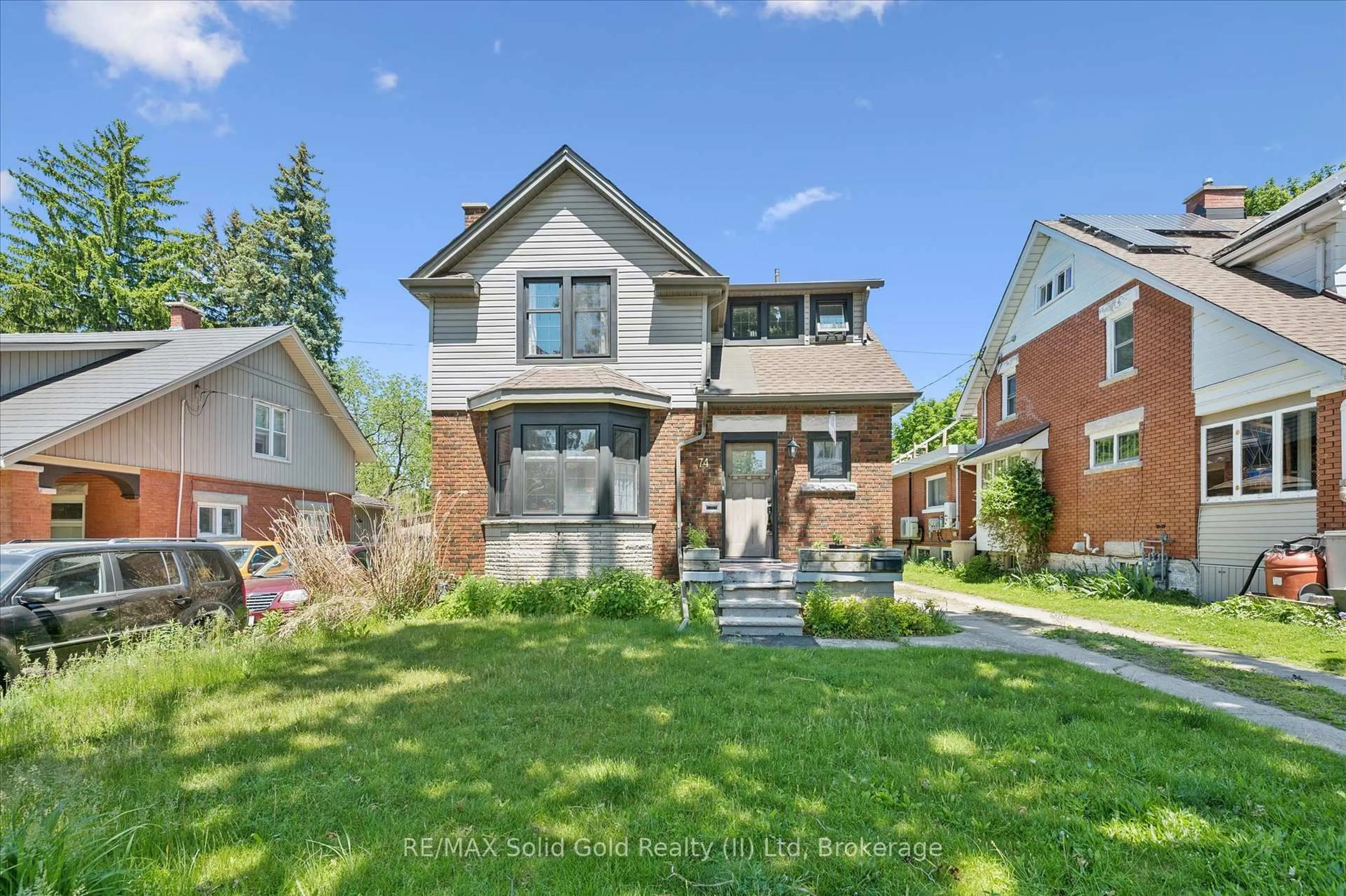 Home with brick exterior material, street for 74 Homewood Ave, Waterloo Ontario N2M 1W9