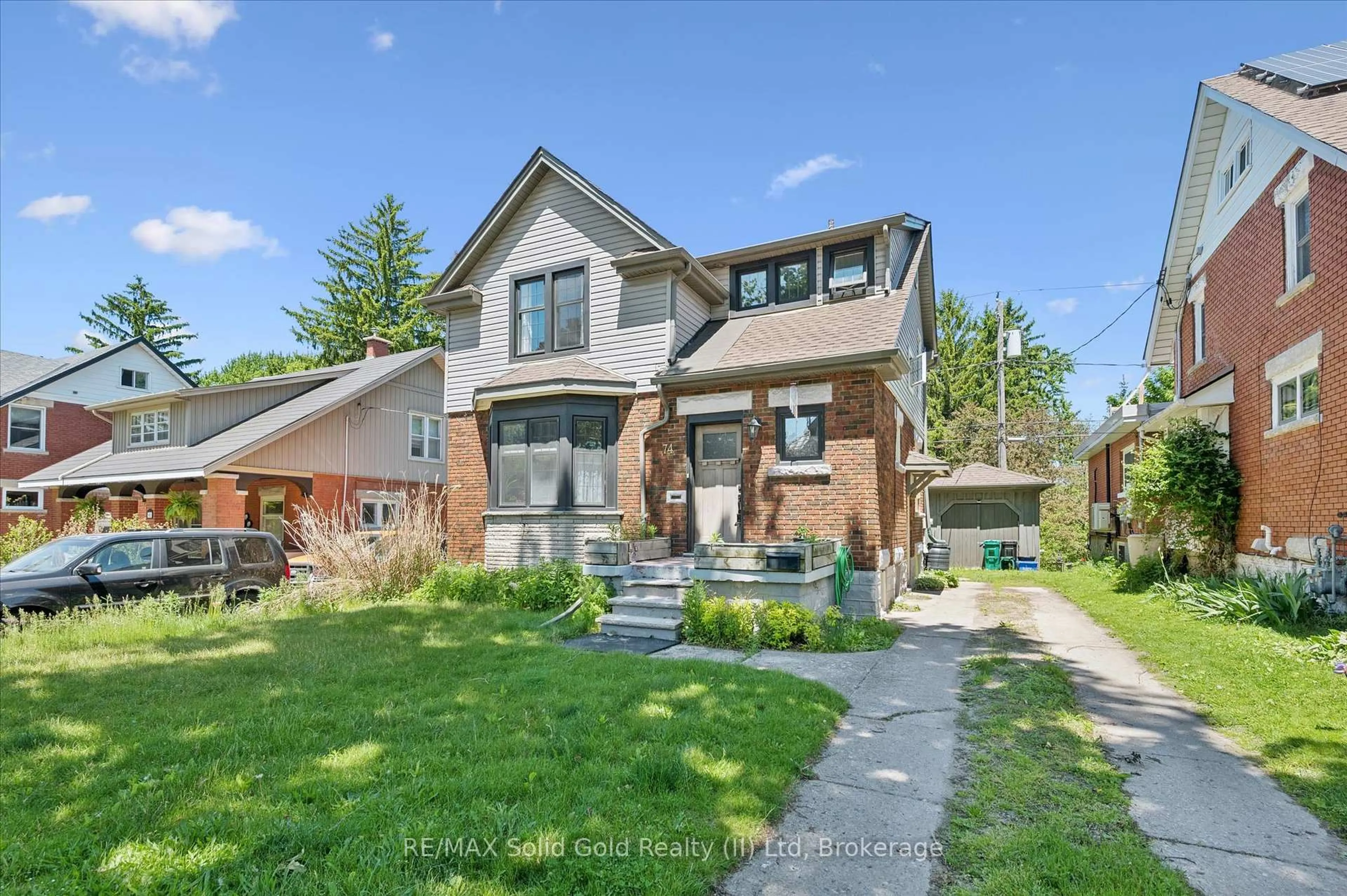 Home with brick exterior material, street for 74 Homewood Ave, Waterloo Ontario N2M 1W9