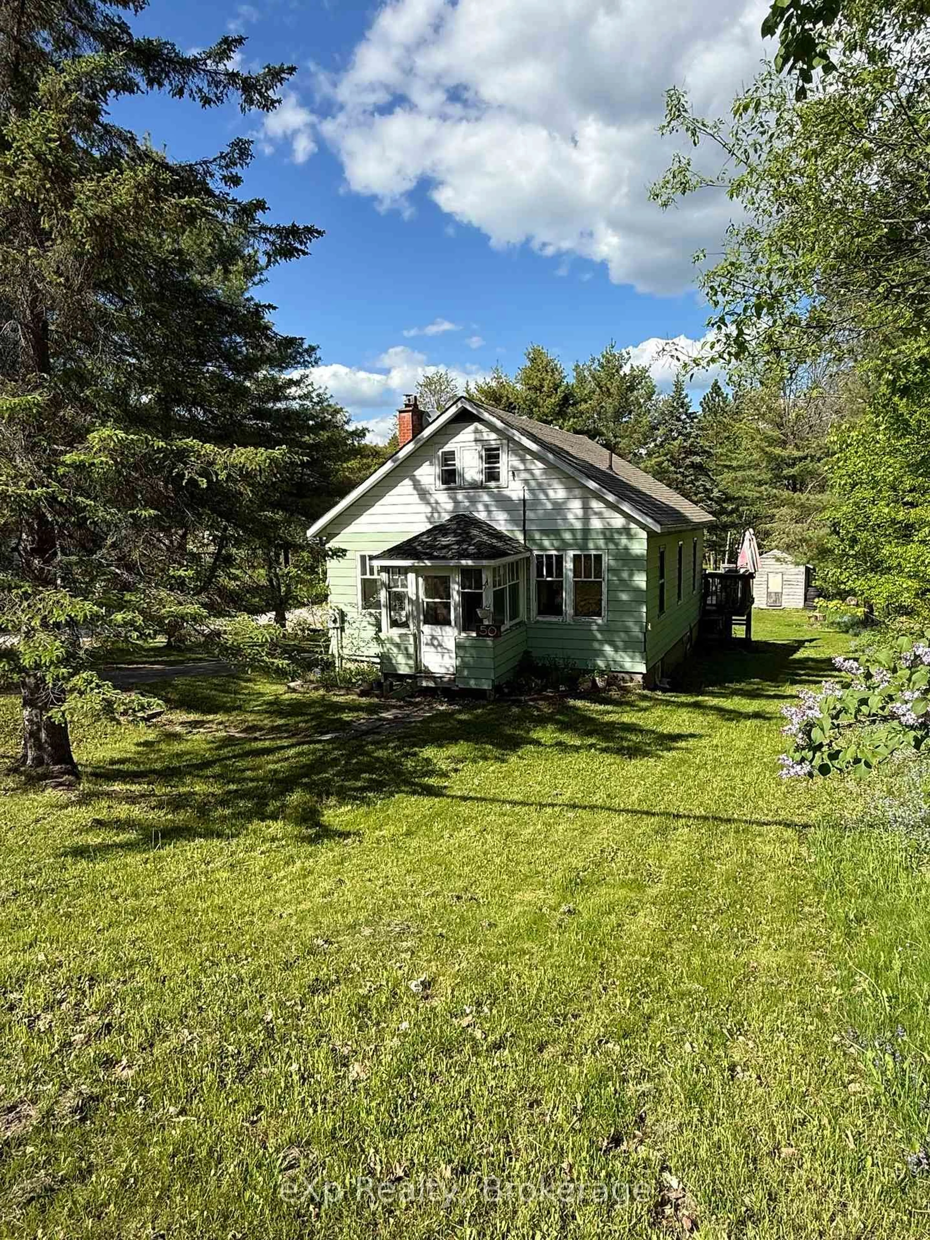 A pic from outside/outdoor area/front of a property/back of a property/a pic from drone, unknown for 50 Joseph St, Muskoka Lakes Ontario P0B 1J0