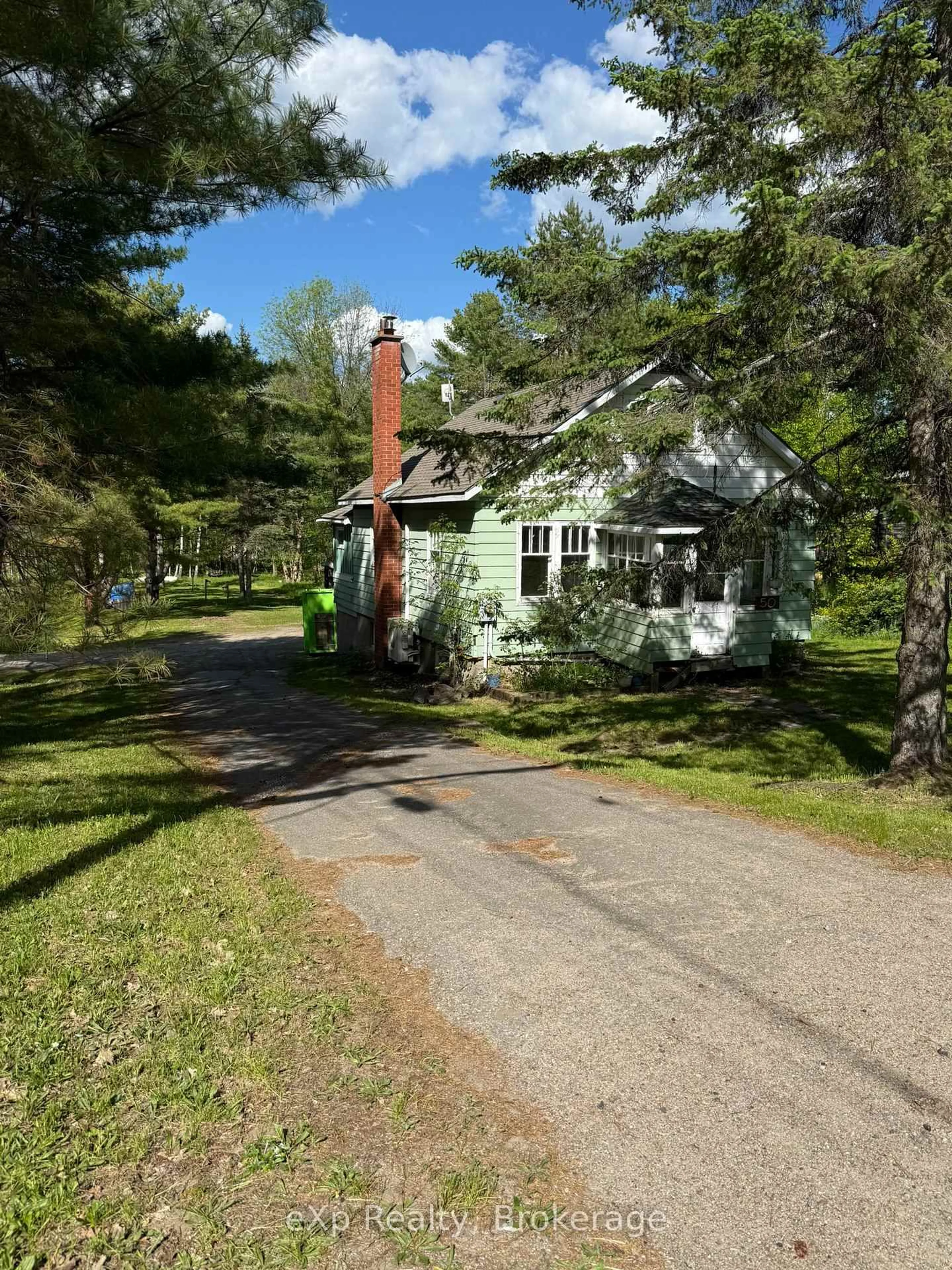 A pic from outside/outdoor area/front of a property/back of a property/a pic from drone, street for 50 Joseph St, Muskoka Lakes Ontario P0B 1J0